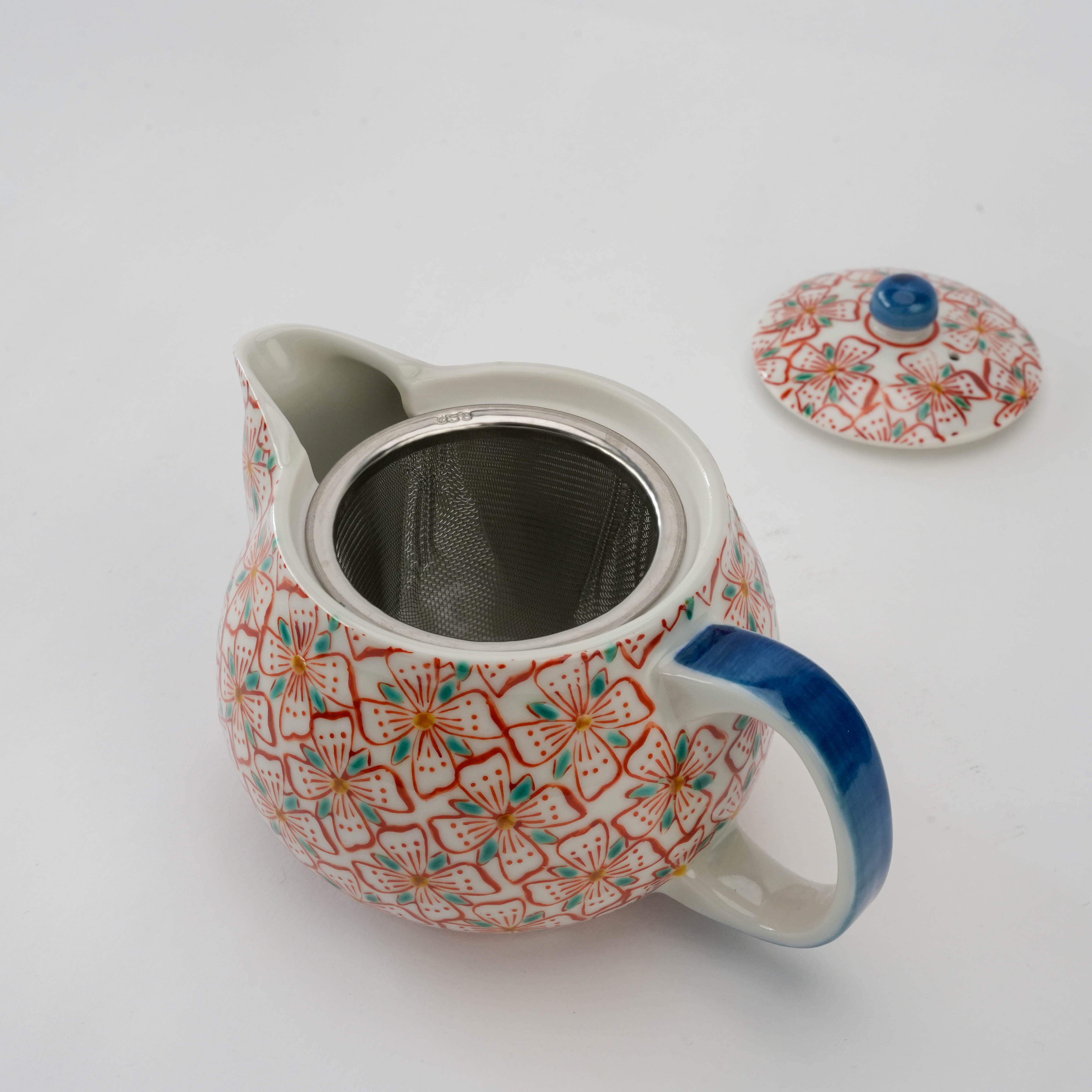 Kutani Ware Teapot - Red Blossom with lid removed, revealing built-in stainless steel infuser, combining beauty and functionality for tea enthusiasts.