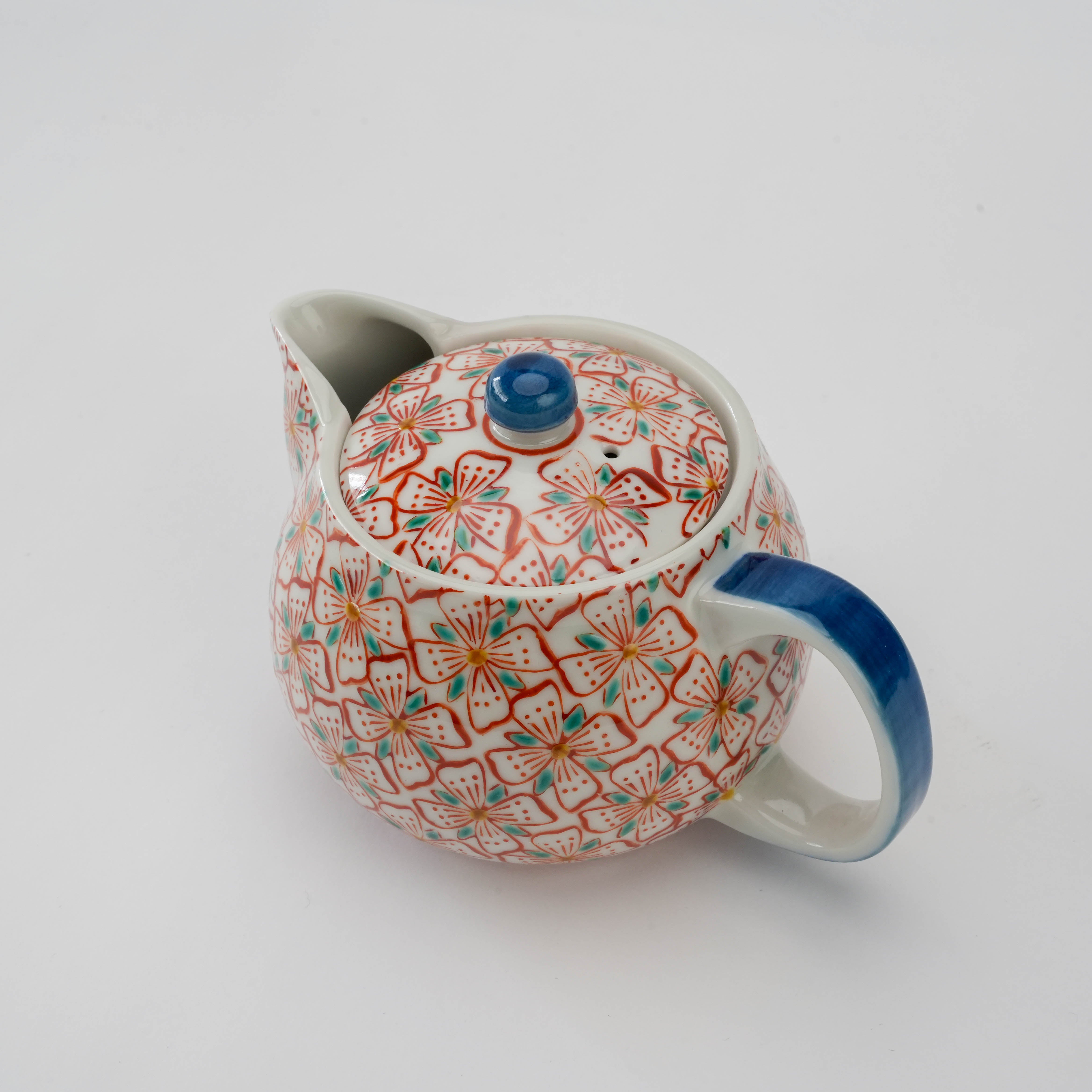 Top view of Kutani Ware Teapot - Red Blossom featuring blue handle and knob, showcasing the vibrant hand-painted blossom pattern on lid and body.