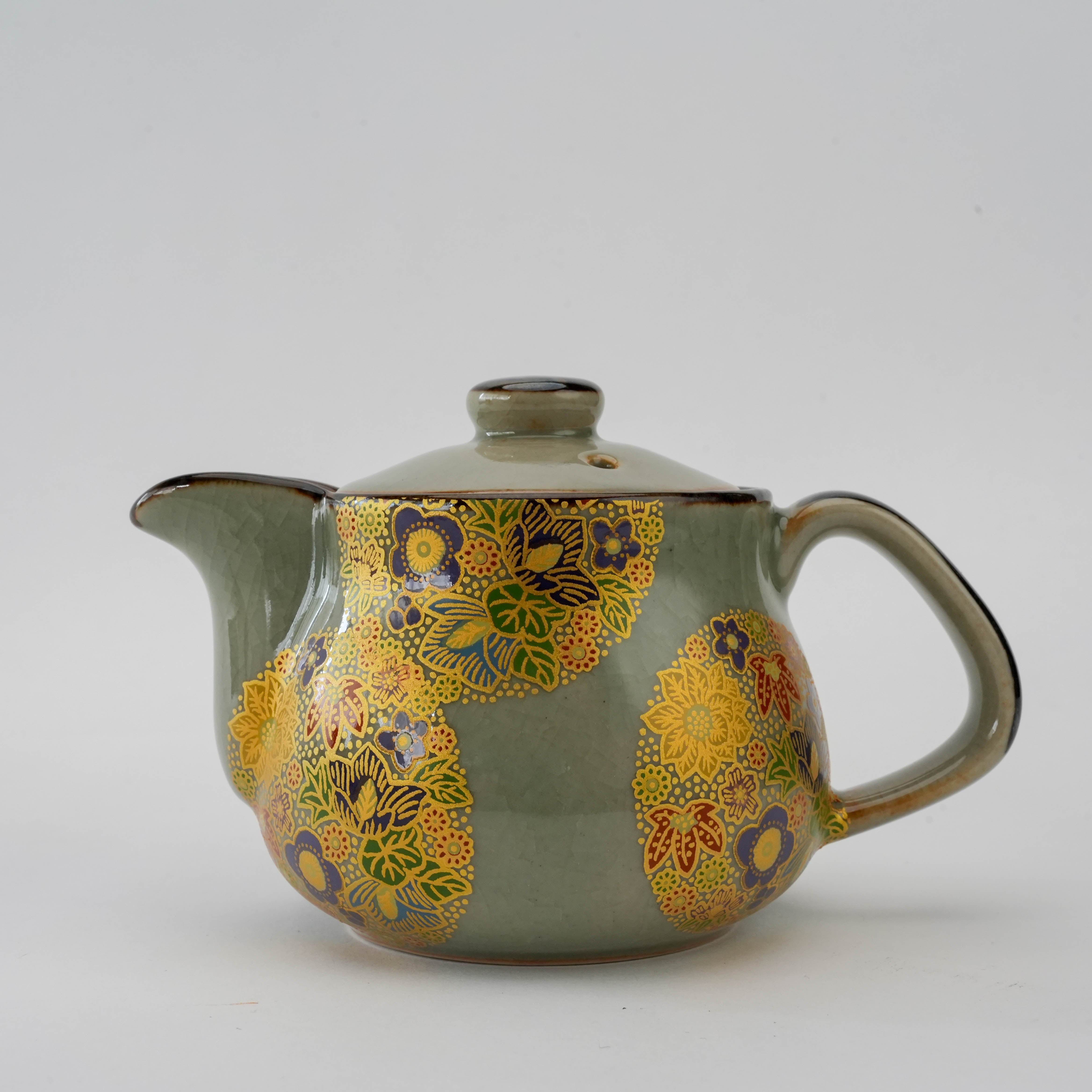 Japanese Kutani Ware teapot with golden floral medallions and curved spout. Ideal for loose-leaf tea, 250ml size with elegant detailing.