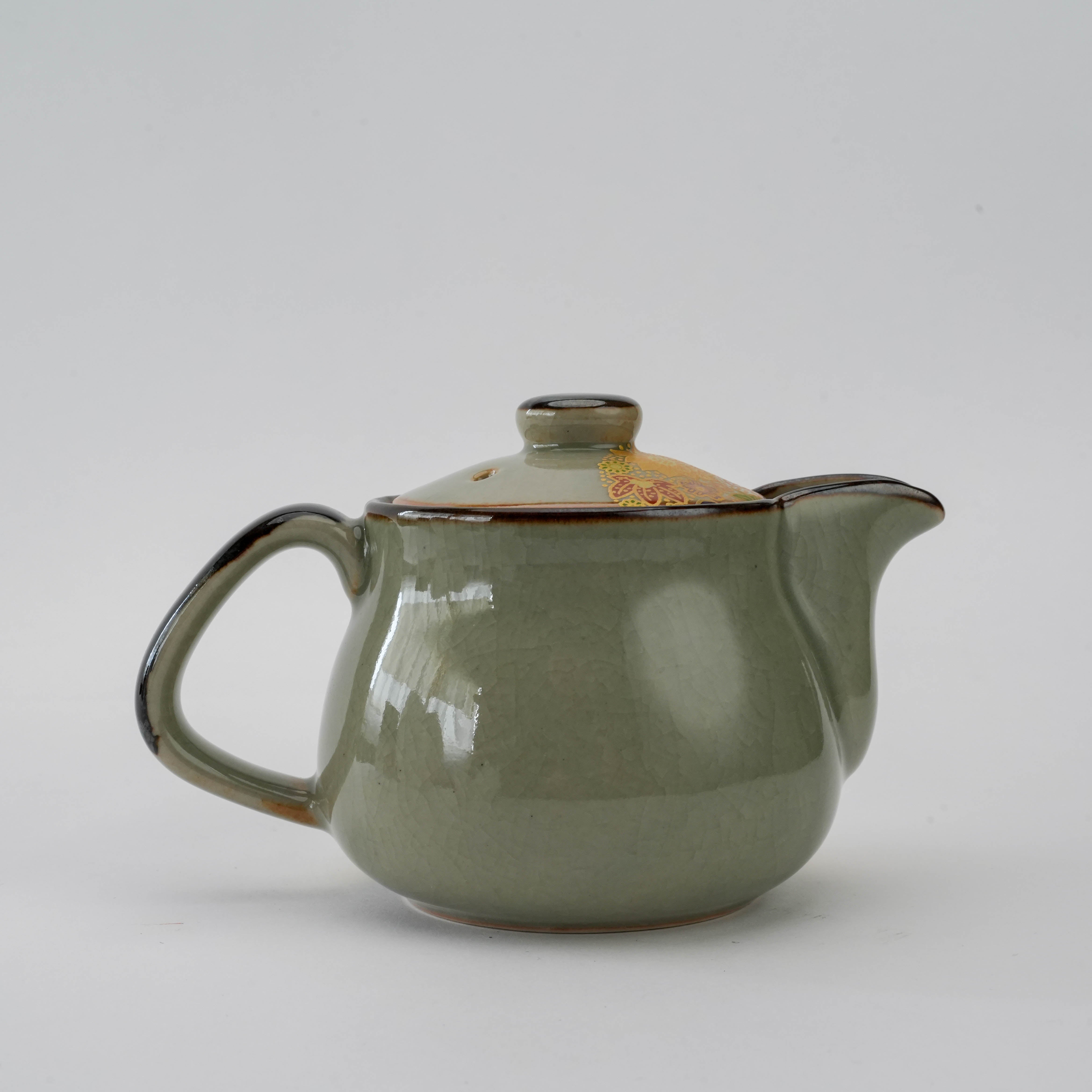 Rear view of Kutani Teapot - Golden Floral Design highlighting smooth ceramic glaze and ergonomic handle. 250ml, made in Japan.