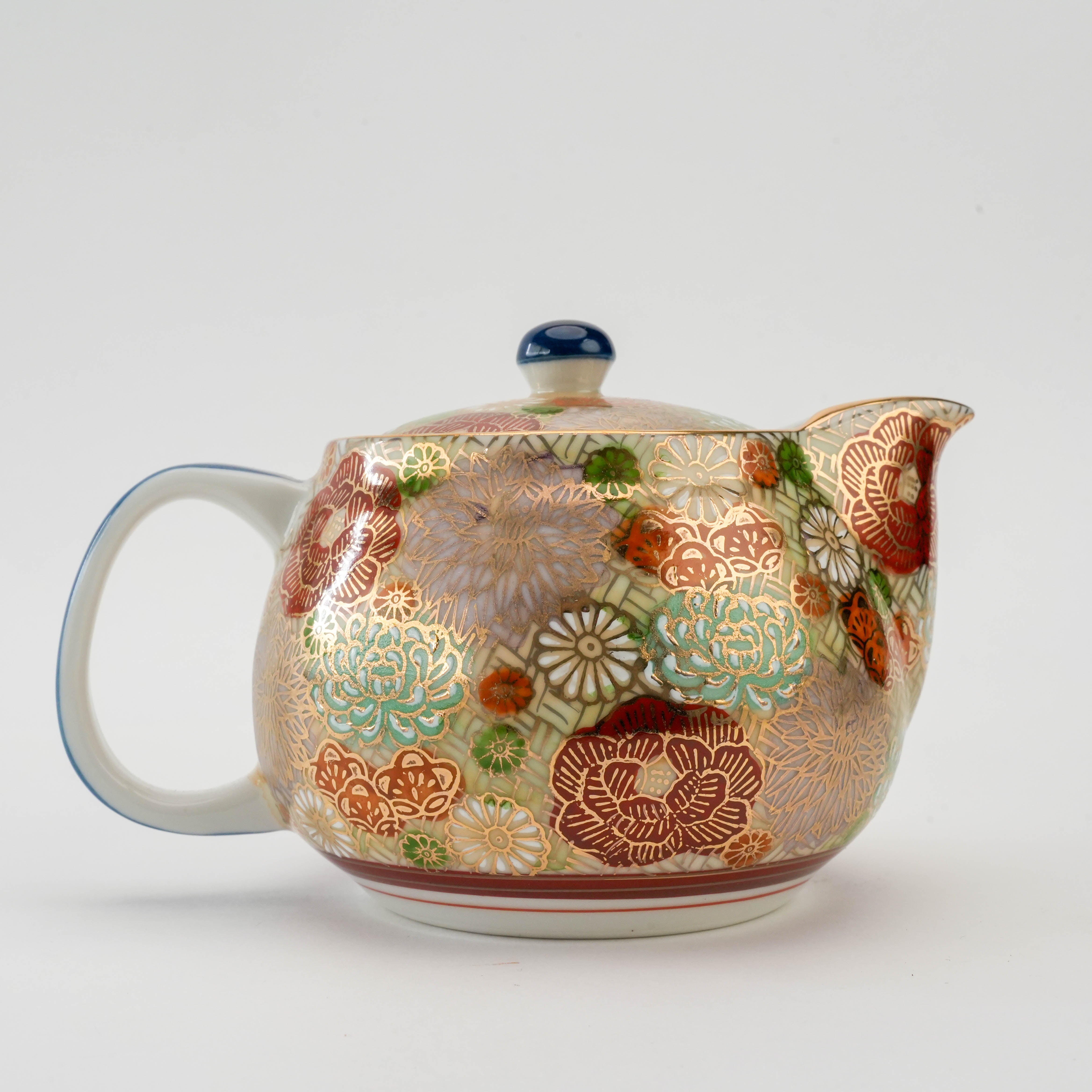 Close-up of Kutani Teapot - Floral Harmony 360ml highlighting detailed red, green, and gold floral motifs on ceramic body.