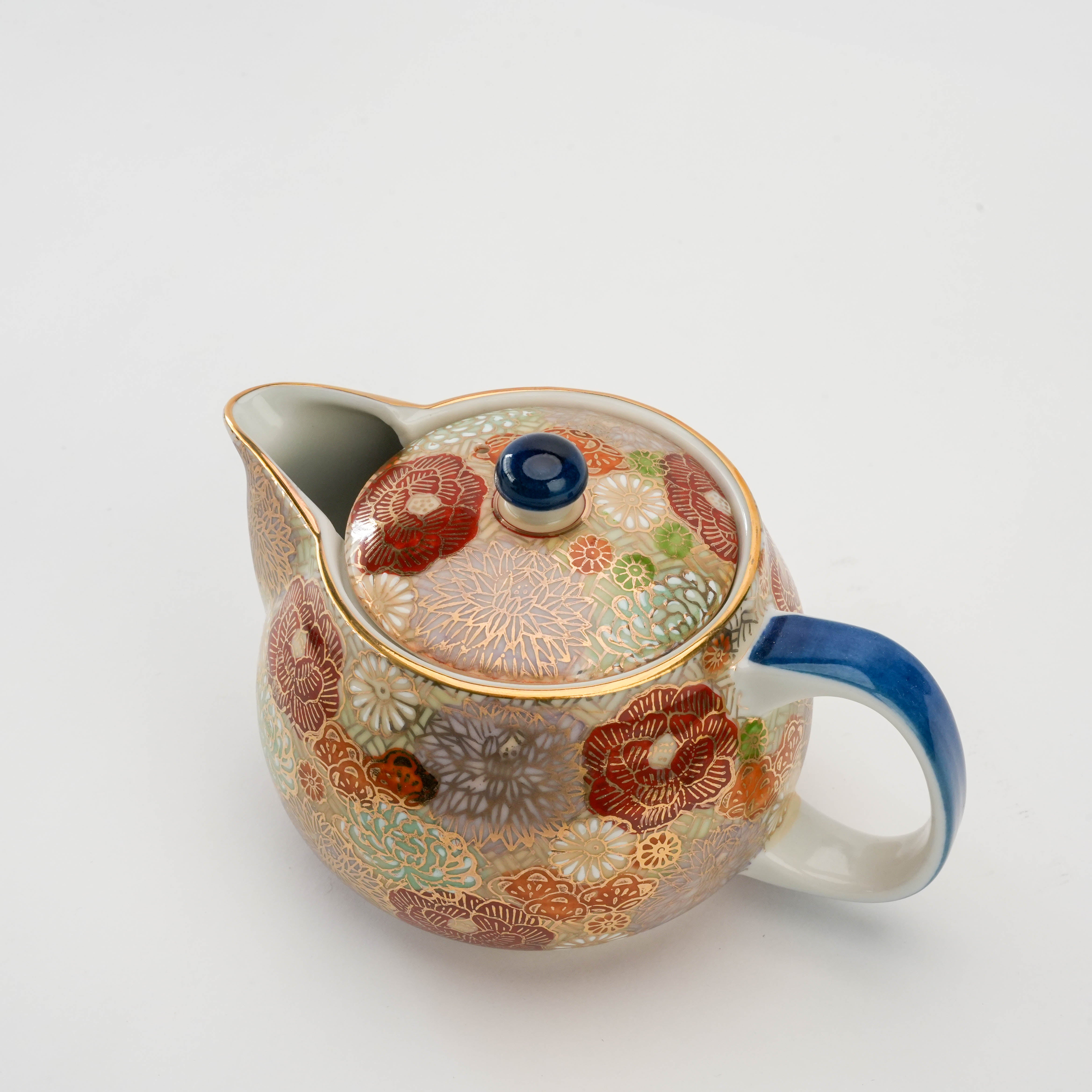 Top angle of Kutani Teapot - Floral Harmony 360ml showing blue-accented handle and lid with intricate floral artwork.