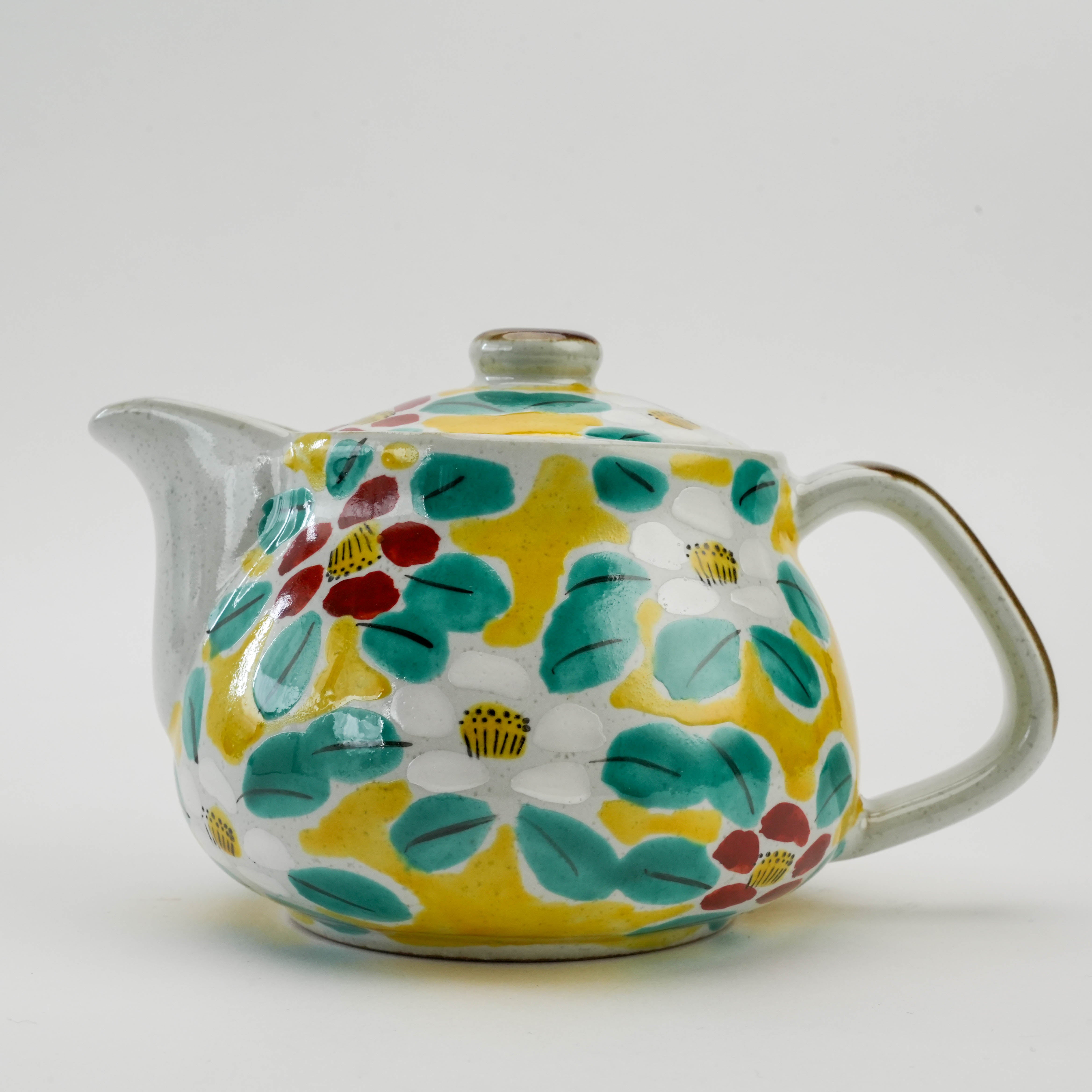 Close-up of Kutani Ware Yellow Blossom Teapot highlighting colorful floral patterns and glossy ceramic finish. Perfect for home tea rituals.