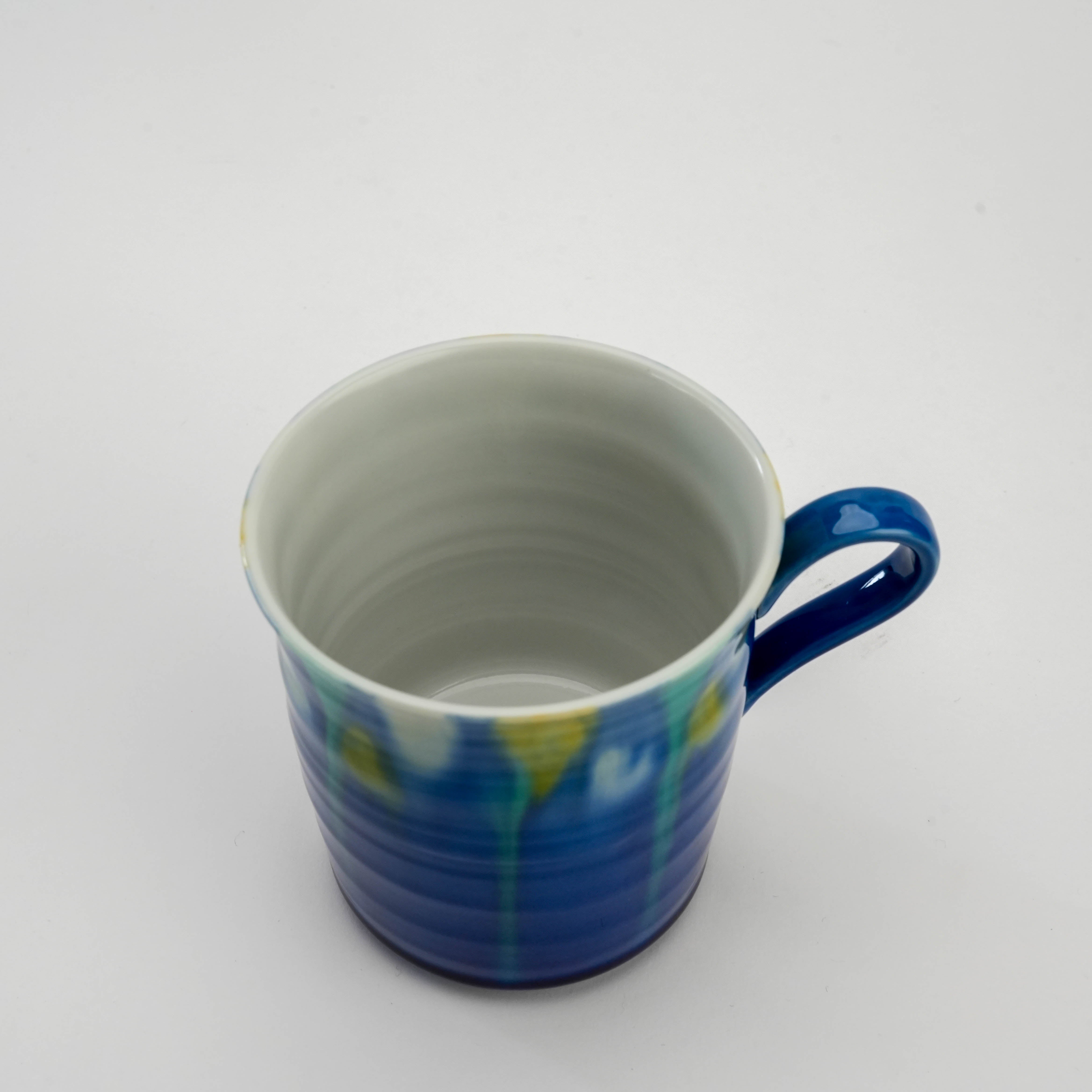 Top view of Kutani Mug highlighting smooth white interior and elegant blue gradient exterior, 8.3×9 cm ceramic drinkware piece.