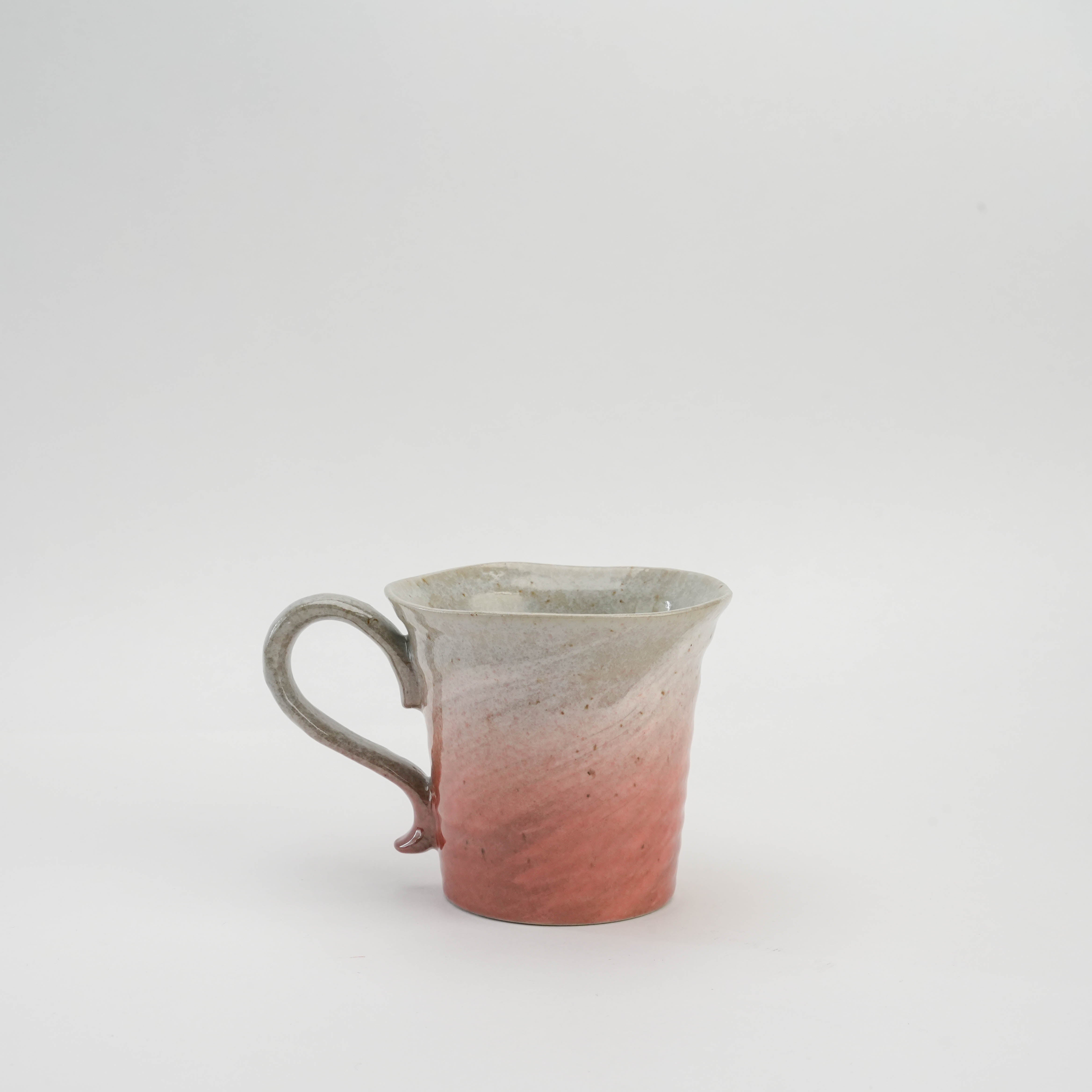 Side view of pink Kutani Ware Sakura Mug with soft gradient glaze and handcrafted details, enhancing Japanese drinkware collections.