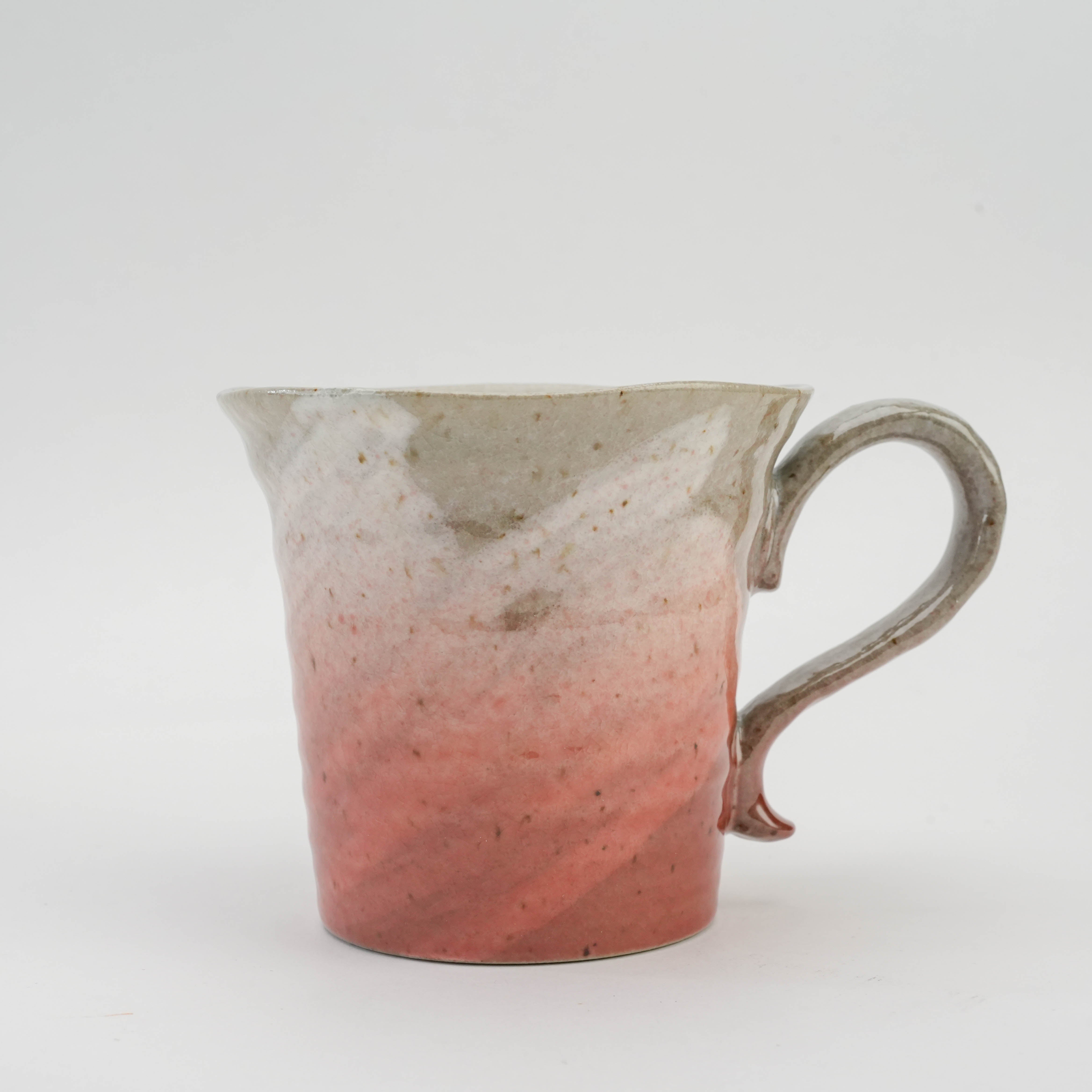 Close-up of pink Kutani Ware Sakura Mug highlighting cherry motif-inspired glaze and traditional Japanese porcelain artistry.