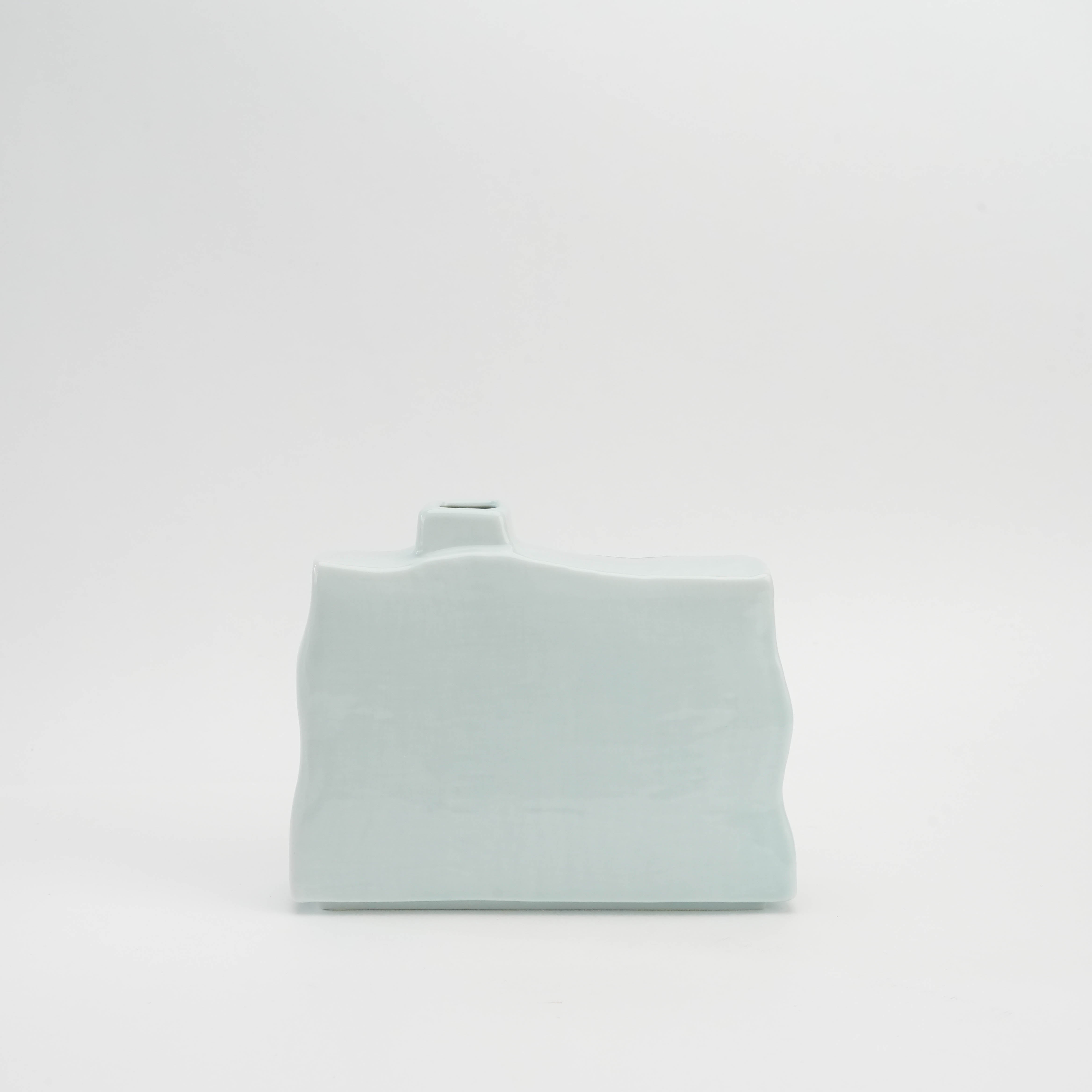 Back view of the Red Fuji Ikebana Vase in soft celadon glaze. Minimalist rear design complements the vibrant Mt. Fuji artwork on the front.