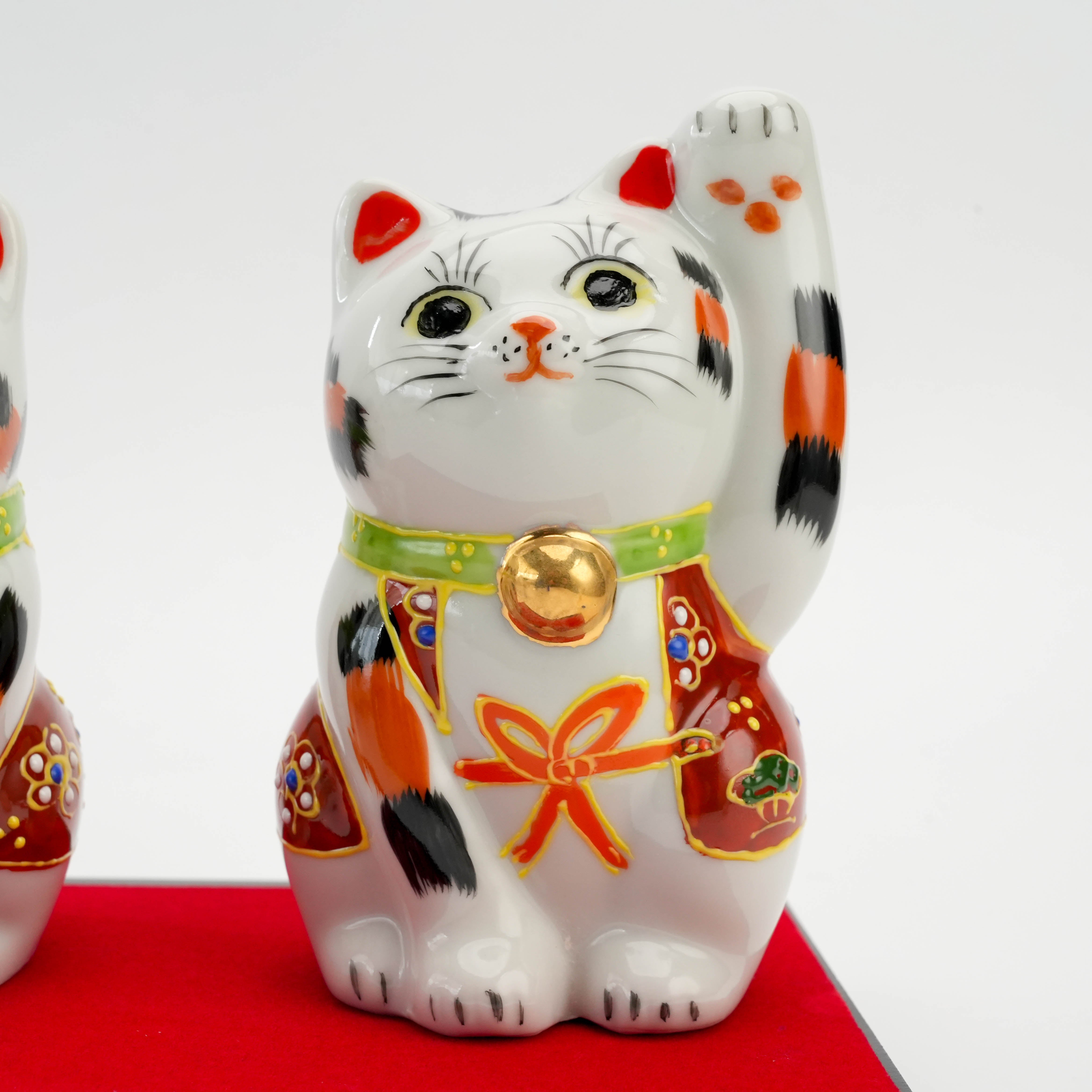 Detailed view of Kutani Calico Lucky Cat - Custom Cat Ornament with vibrant hand-painted kimono and welcoming gesture, ideal for decor or gifts.