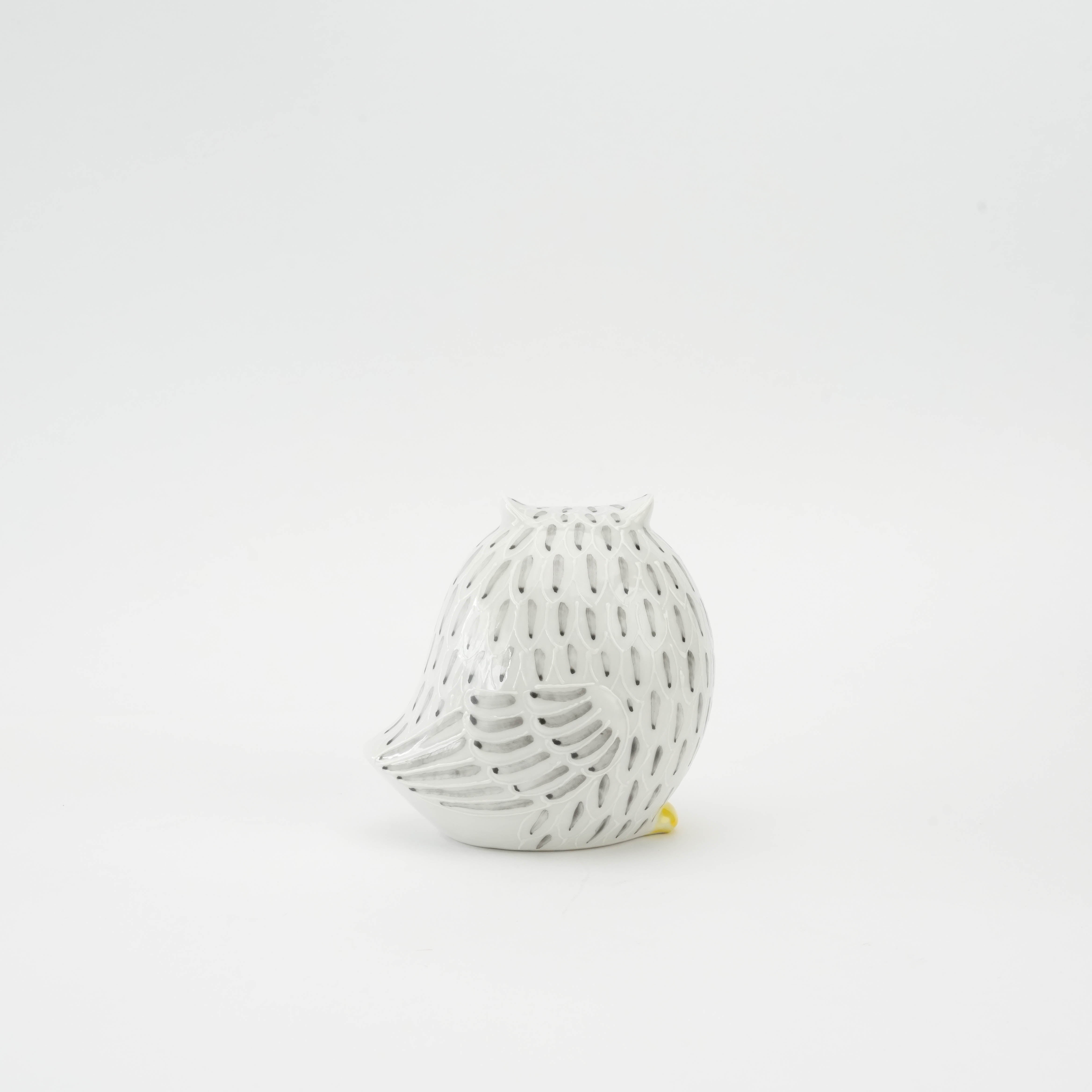 Side view of Kutani Owl Figurine highlighting black etched feather design on white ceramic. Elegant accent piece for shelves or mantels.