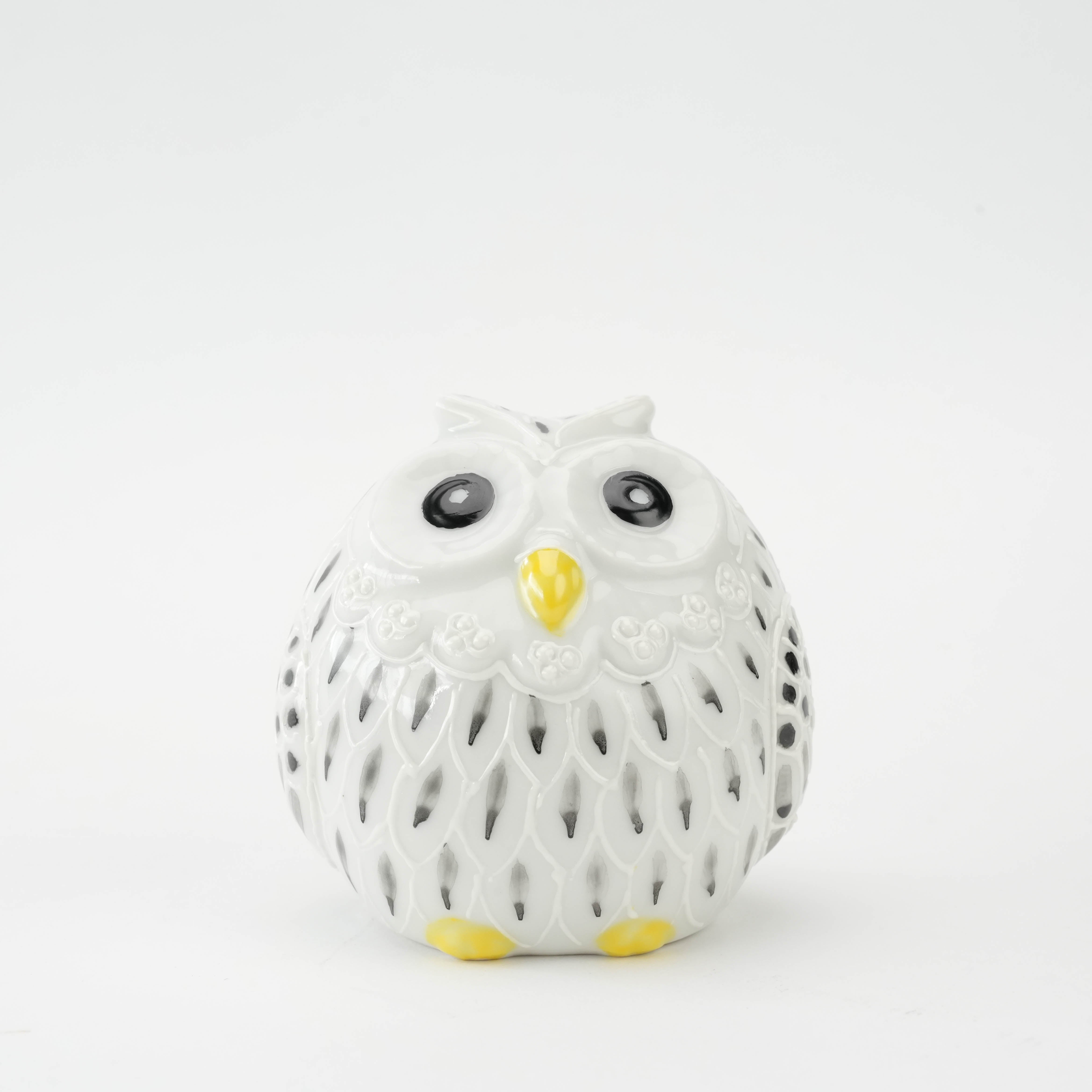 Front view of Kutani Owl Figurine - White & Black Detailing with large expressive eyes and yellow beak, perfect for home accents.