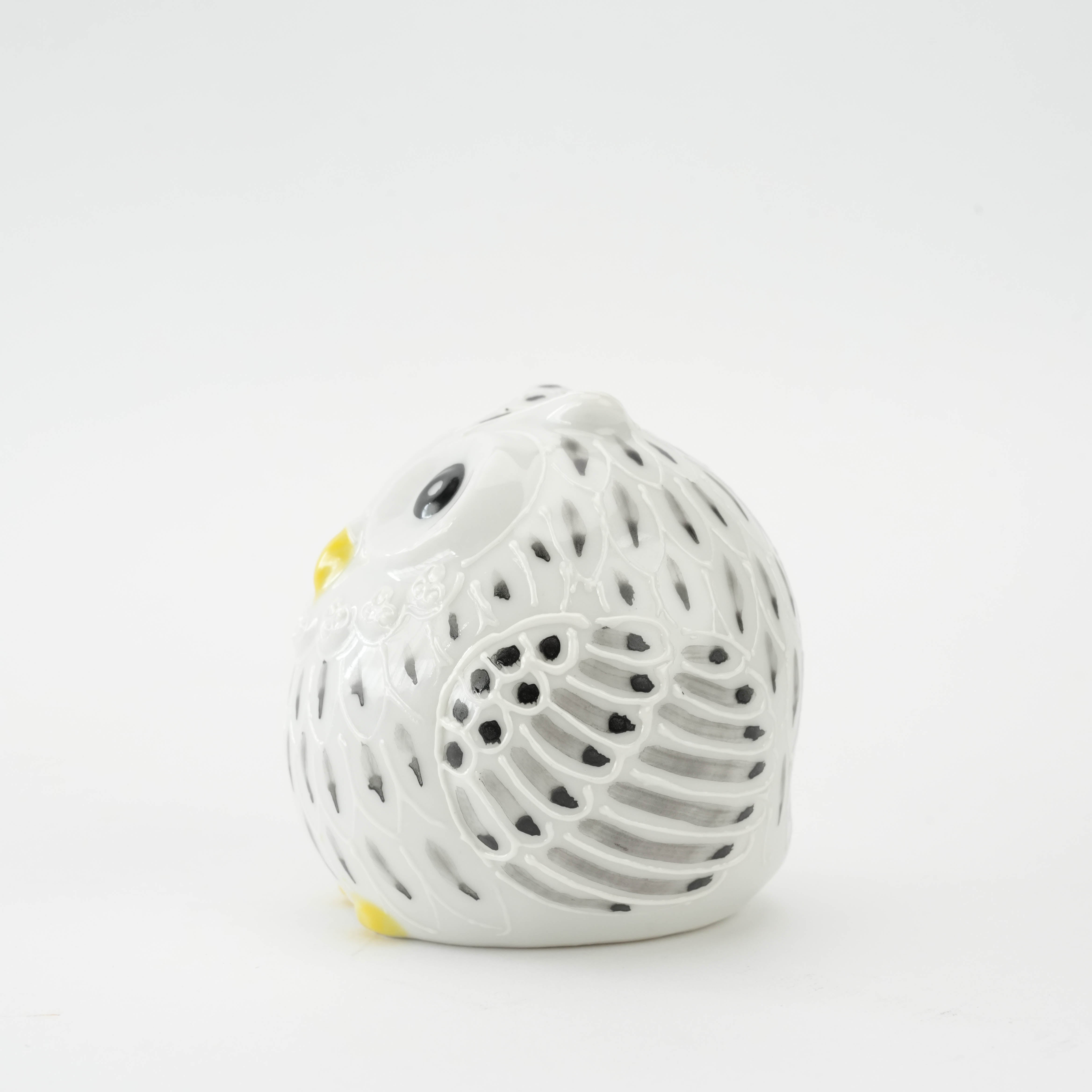 Side profile of Kutani Ware Owl Figurine showing detailed wing patterns and perforated ceramic design, a symbol of wisdom and fortune.