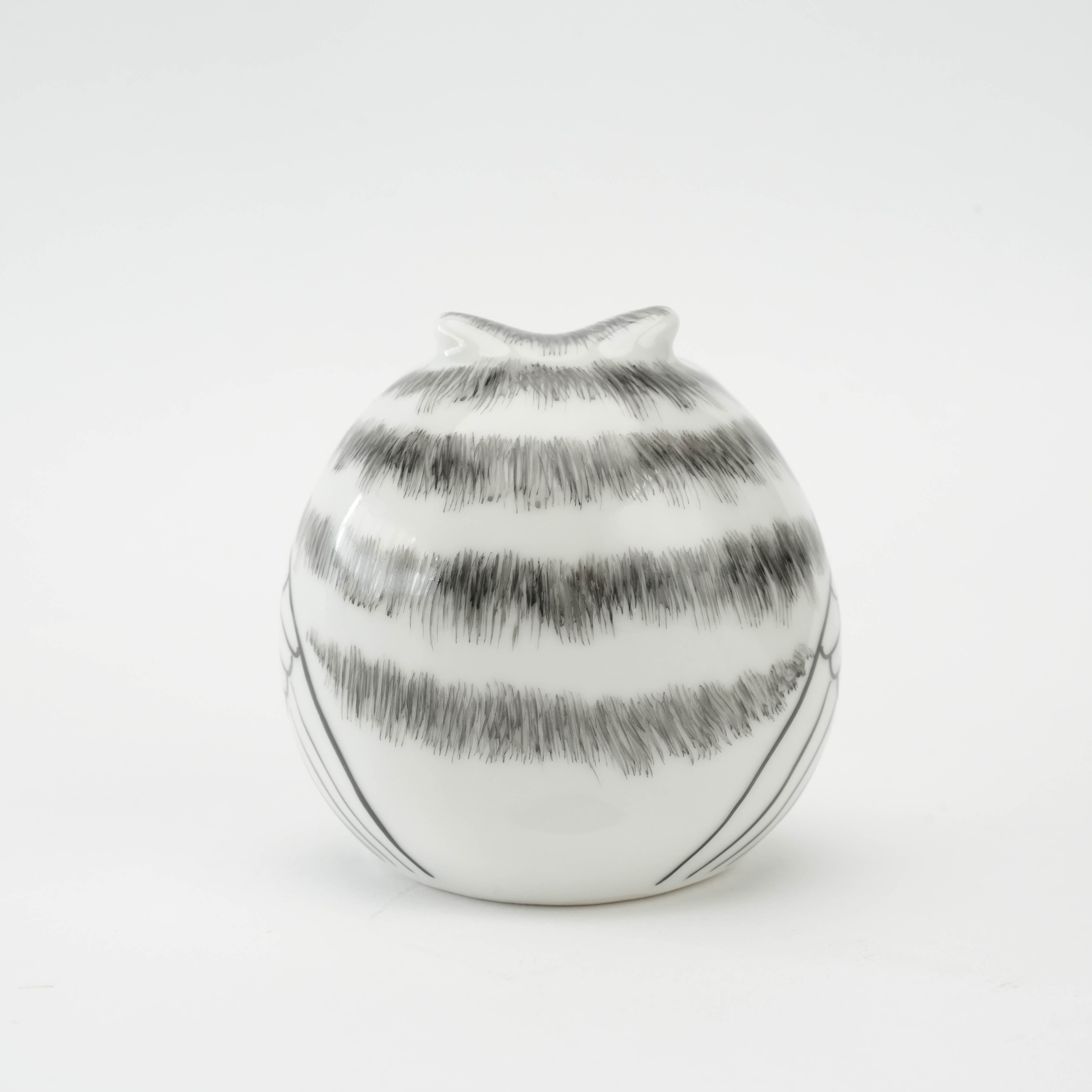 Back view of white Kutani Owl Figurine with horizontal grey feather lines, crafted for symbolic decor in home and garden settings.