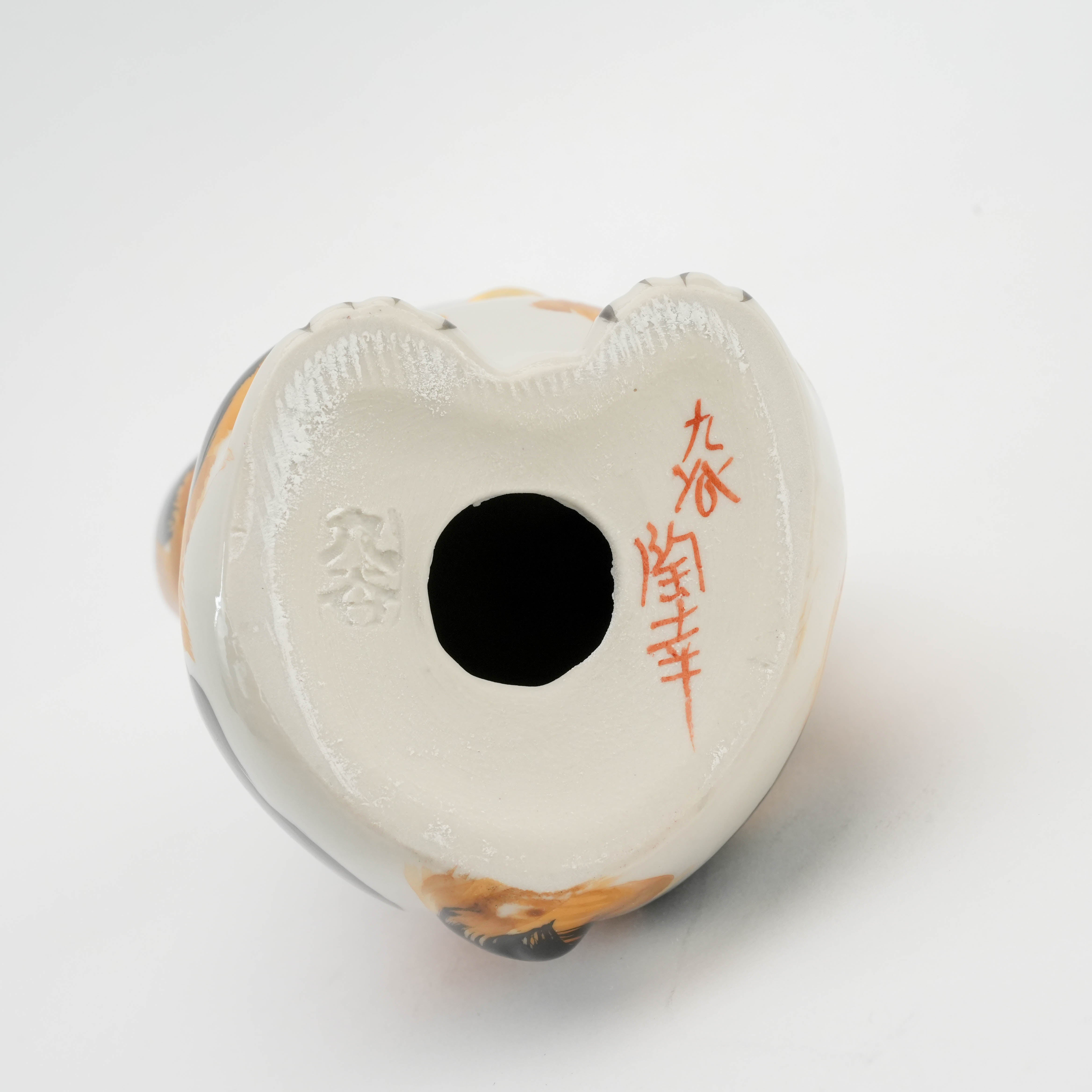 Base of Kutani Ware Cat Ornament featuring artist's signature and kiln mark, authenticating its handcrafted Japanese ceramic origin.