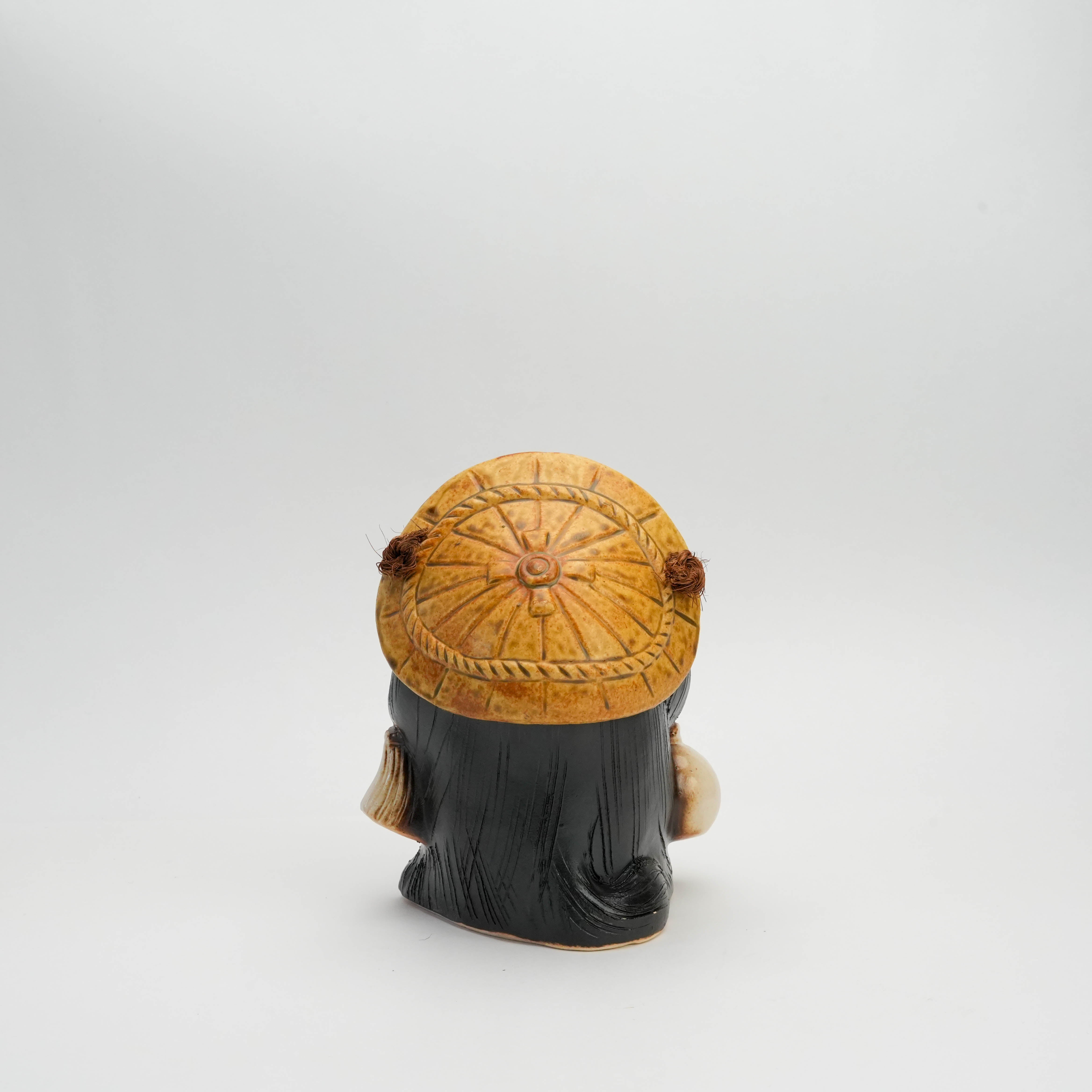 Rear view of Shigaraki Ware 'Hineri' Tanuki Raccoon Ornament showing the detailed straw hat and ceramic finish, ideal for home or garden decor.