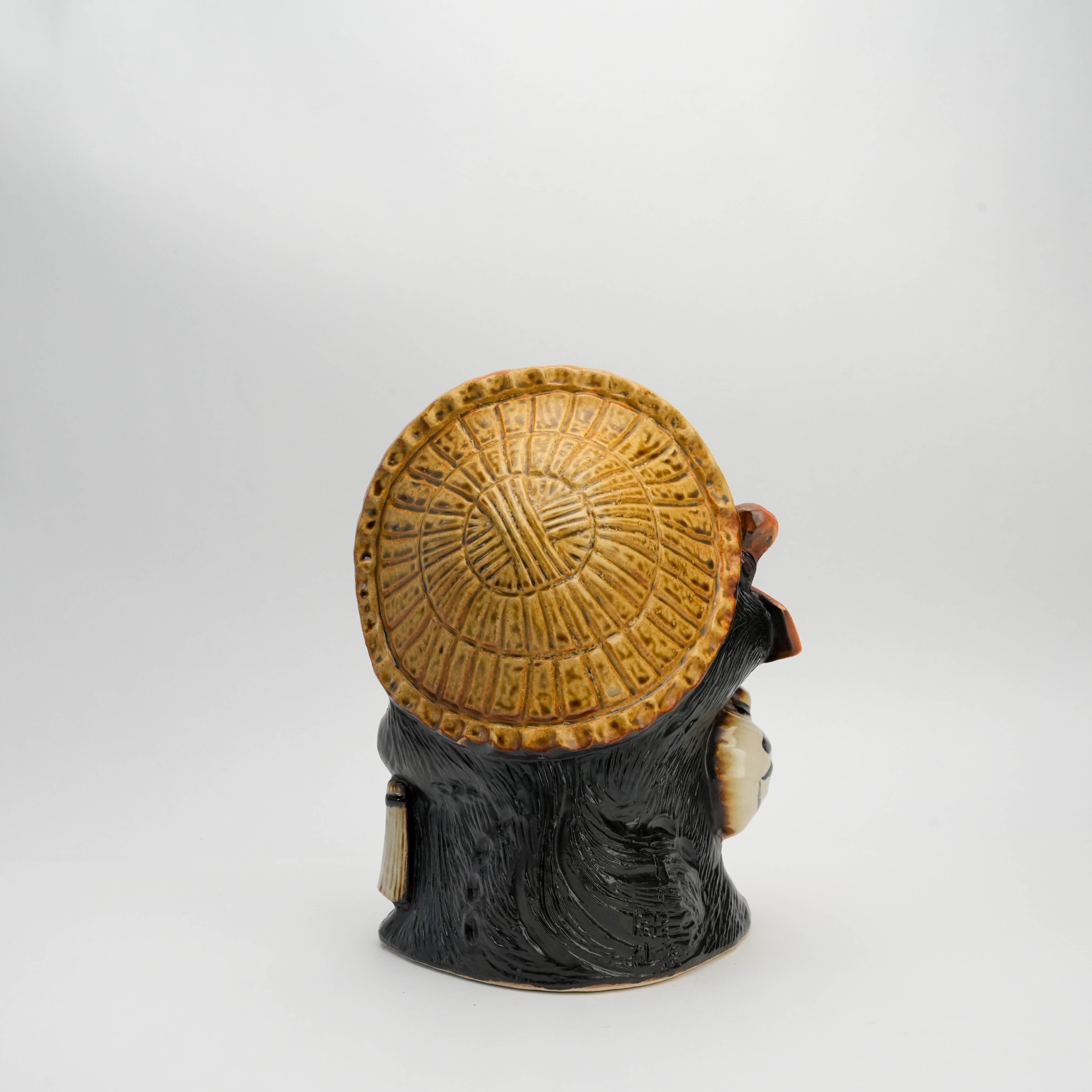 Rear view of Shigaraki Kaiun Raccoon Dog Ornament featuring textured straw hat, showcasing traditional ceramic artistry for home and garden decor.