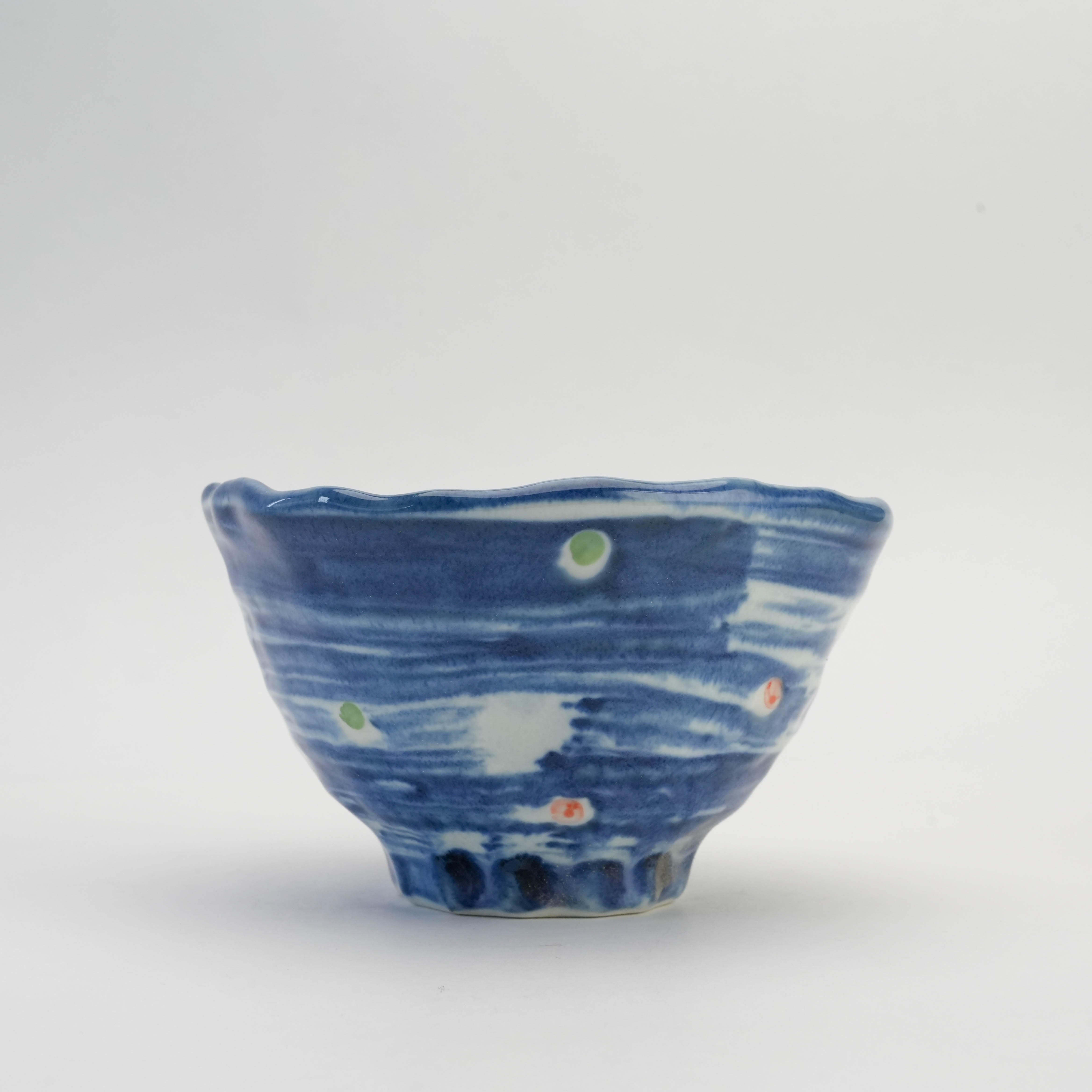 Close-up of Mino Ware Hakeme Polka Dot Donburi Bowl showing indigo glaze and colorful dot accents, crafted for elegant Japanese dining.