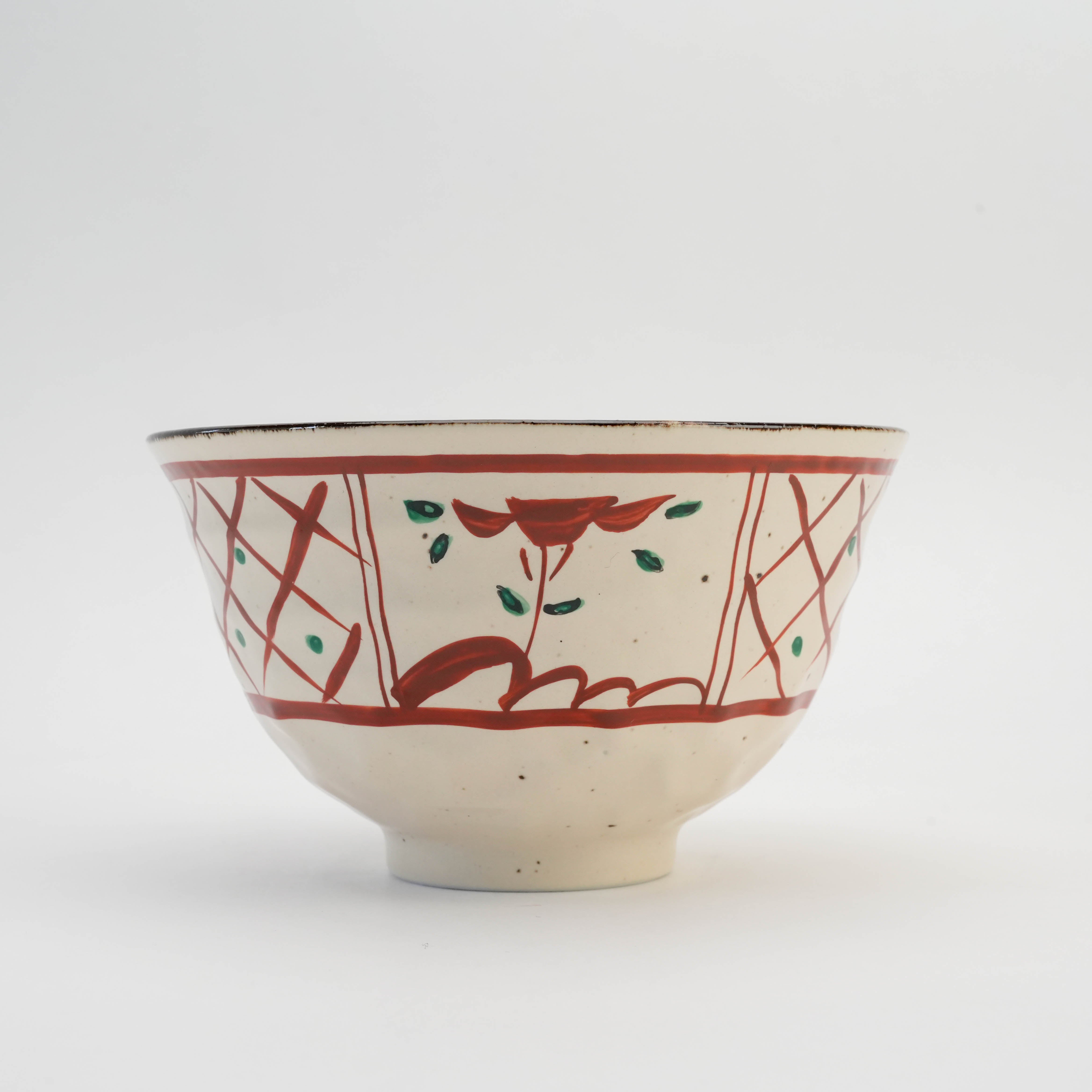 Close-up of Mino Ware Hand-Painted Lattice & Flower Donburi Bowl showcasing traditional Japanese patterns in red and green.