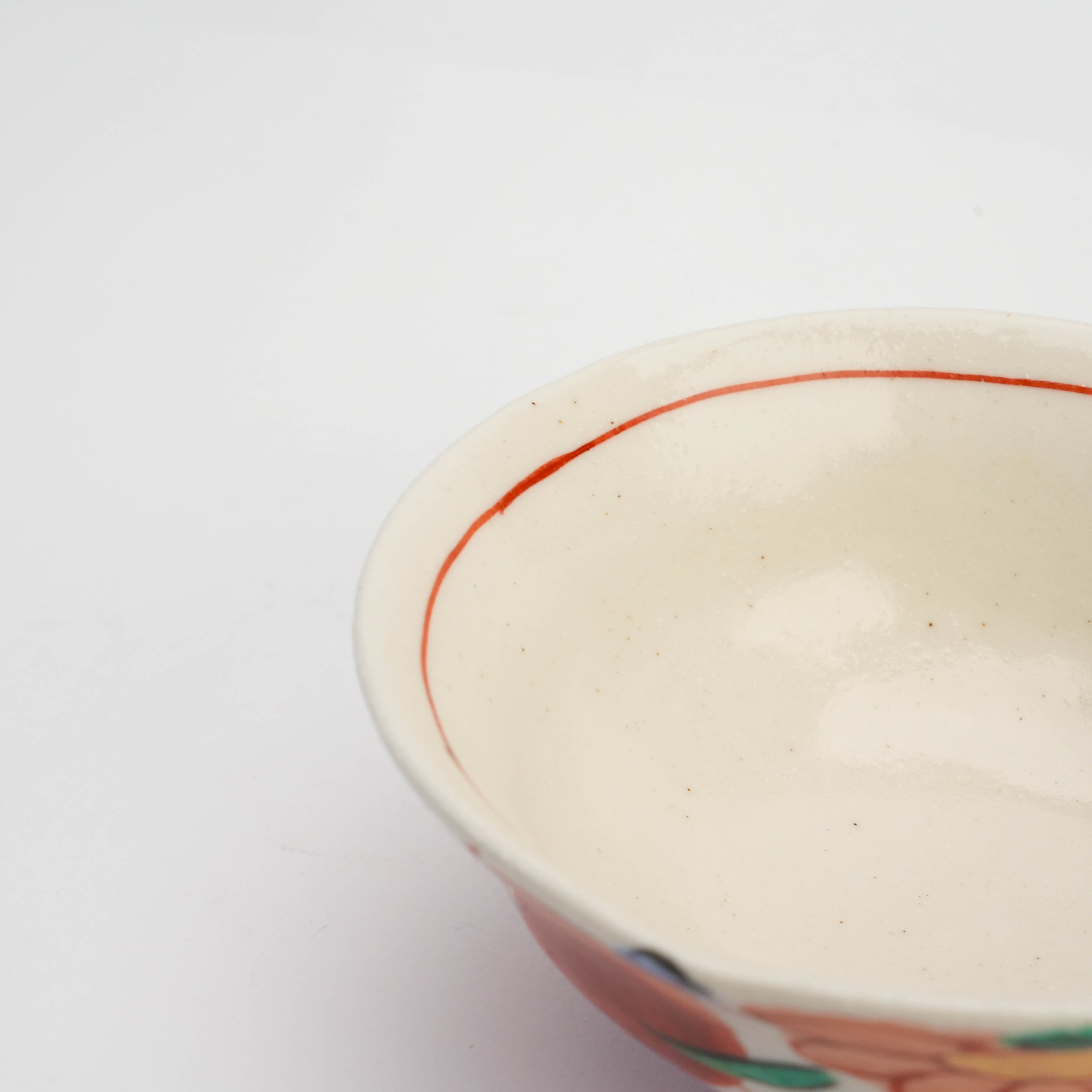 Interior view of Mino Ware Akae Konoha Rice Bowl with smooth cream glaze and red rim, highlighting its artisanal craftsmanship and rustic appeal.
