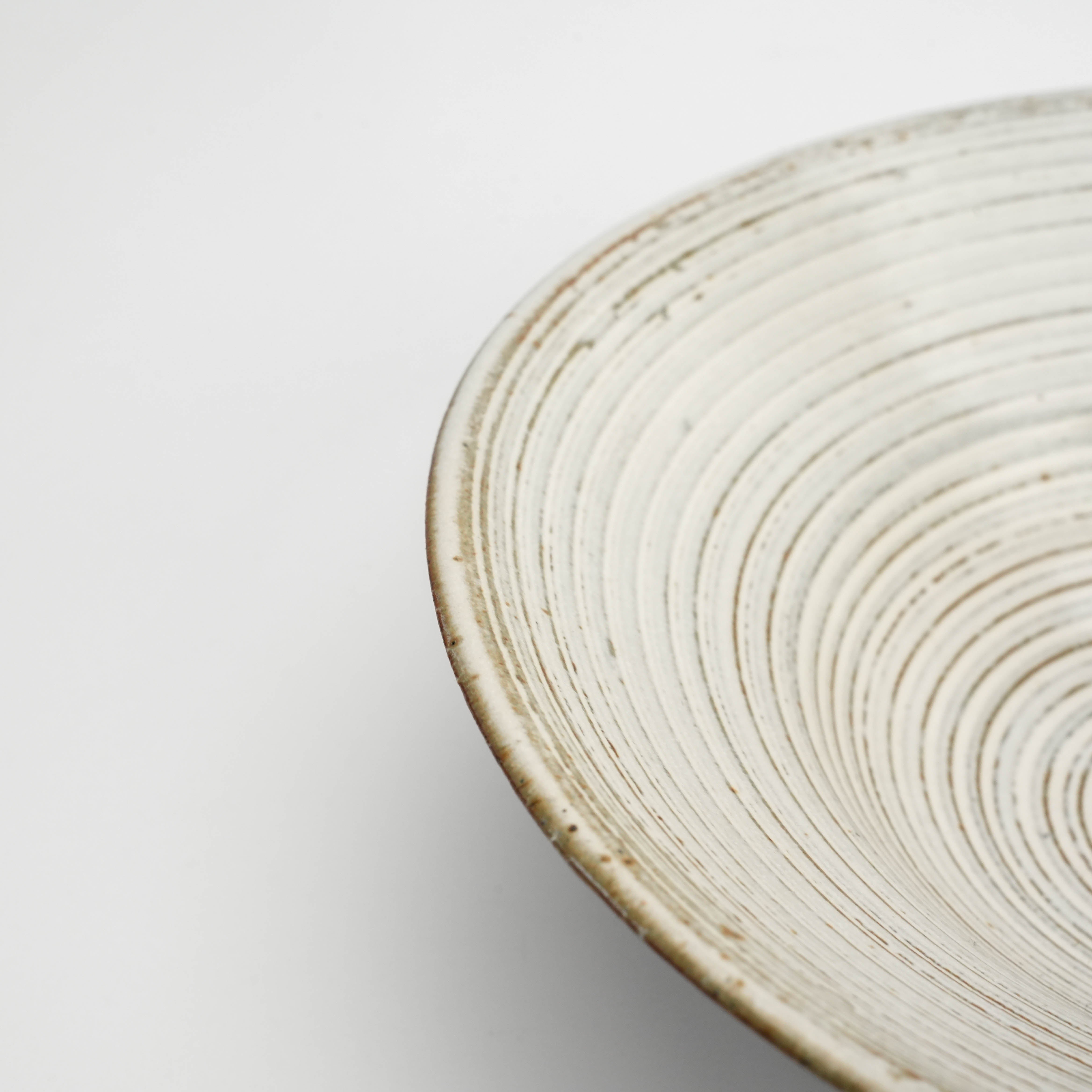 Close-up of Mino Ware Kushime Bowl's textured spiral interior and white glaze finish, highlighting its handcrafted Japanese artistry.