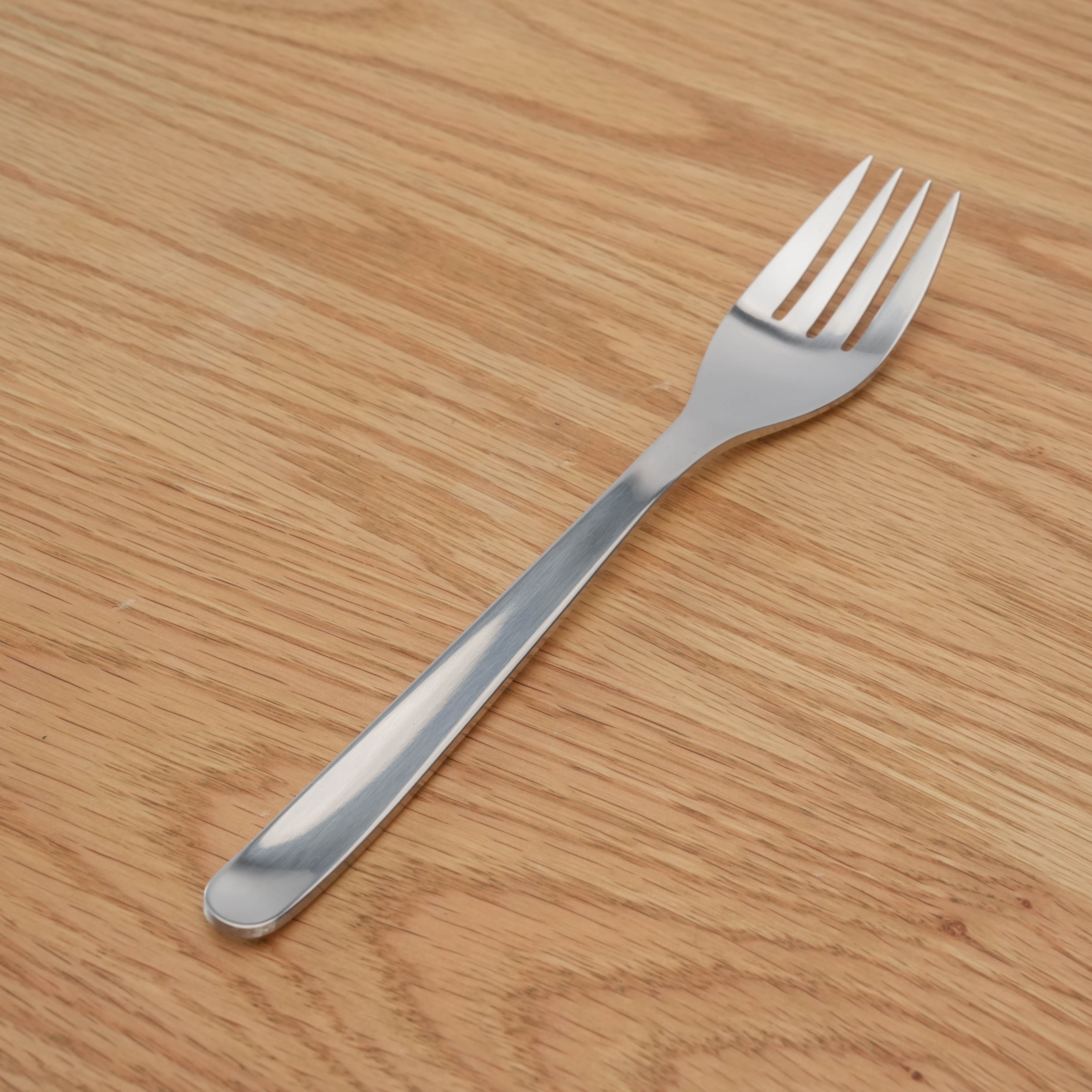 Sori Yanagi Fork - Stainless Steel with elegant, minimalist design, shown on a wooden surface for kitchen and dining use.