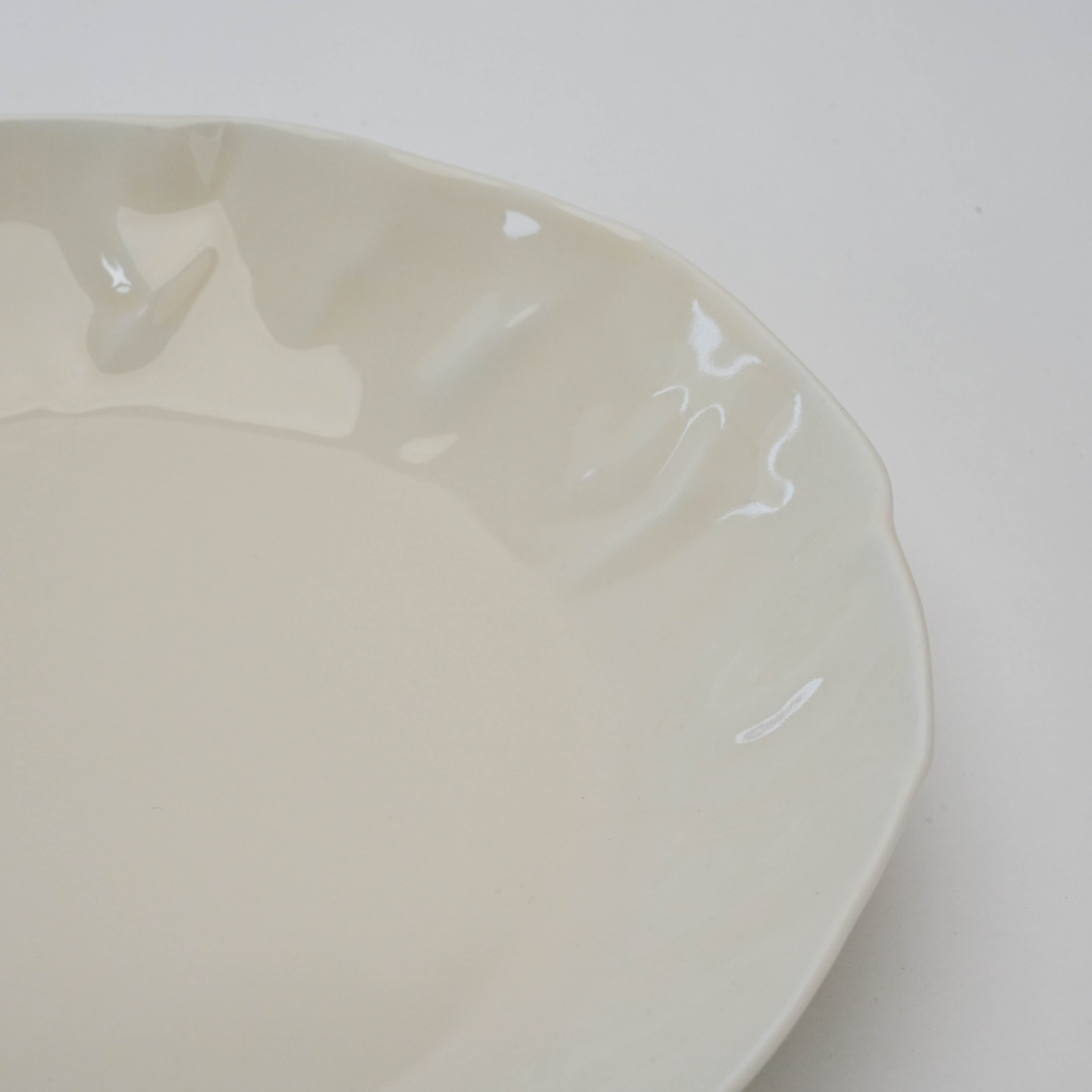 Close-up of white Hasami Ware Papyrus Dish showing glossy ceramic texture and handcrafted edge detail for refined tableware.