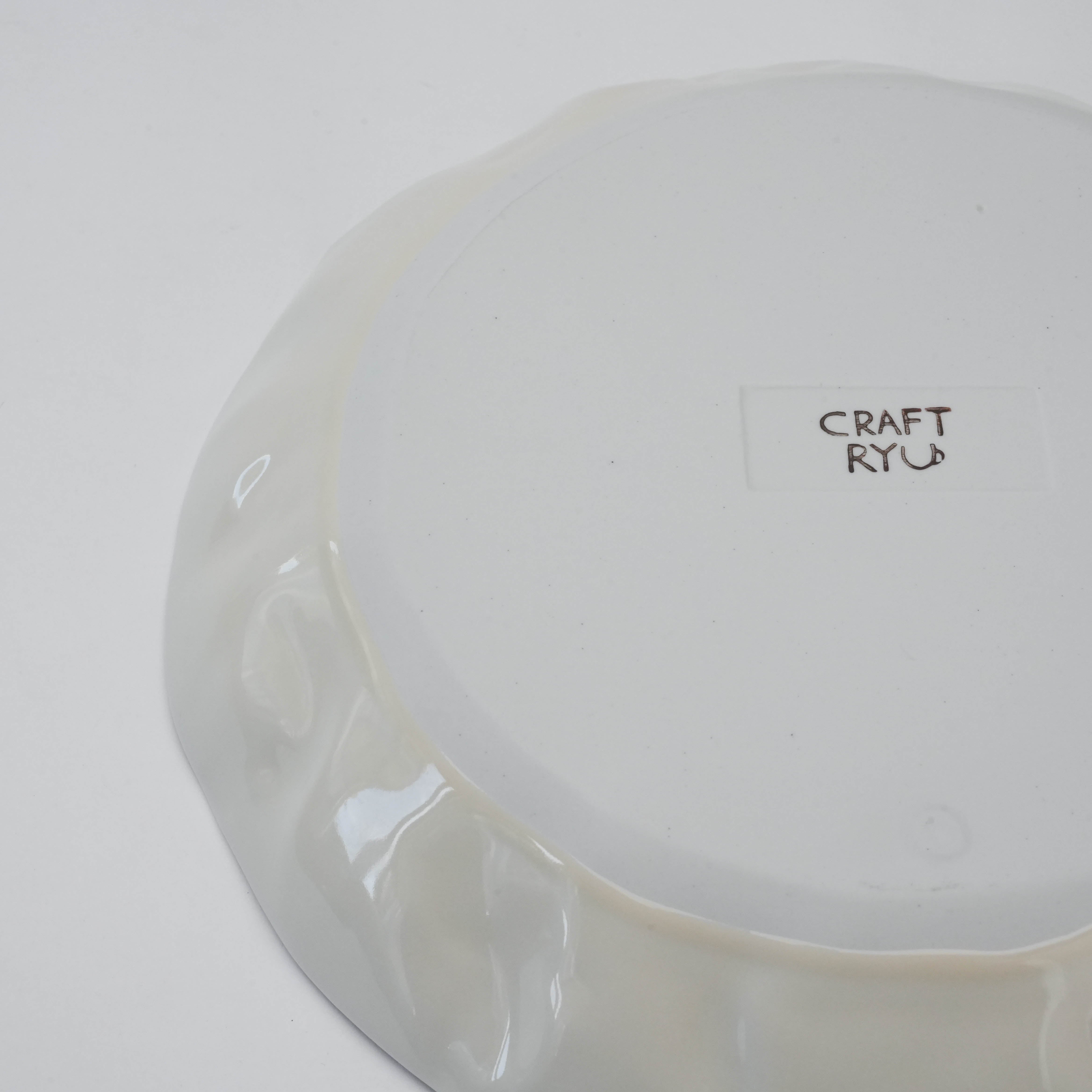 Bottom view of white Hasami Ware Papyrus Dish with 'CRAFT RYU' logo, reflecting its handmade quality and Japanese ceramic tradition.