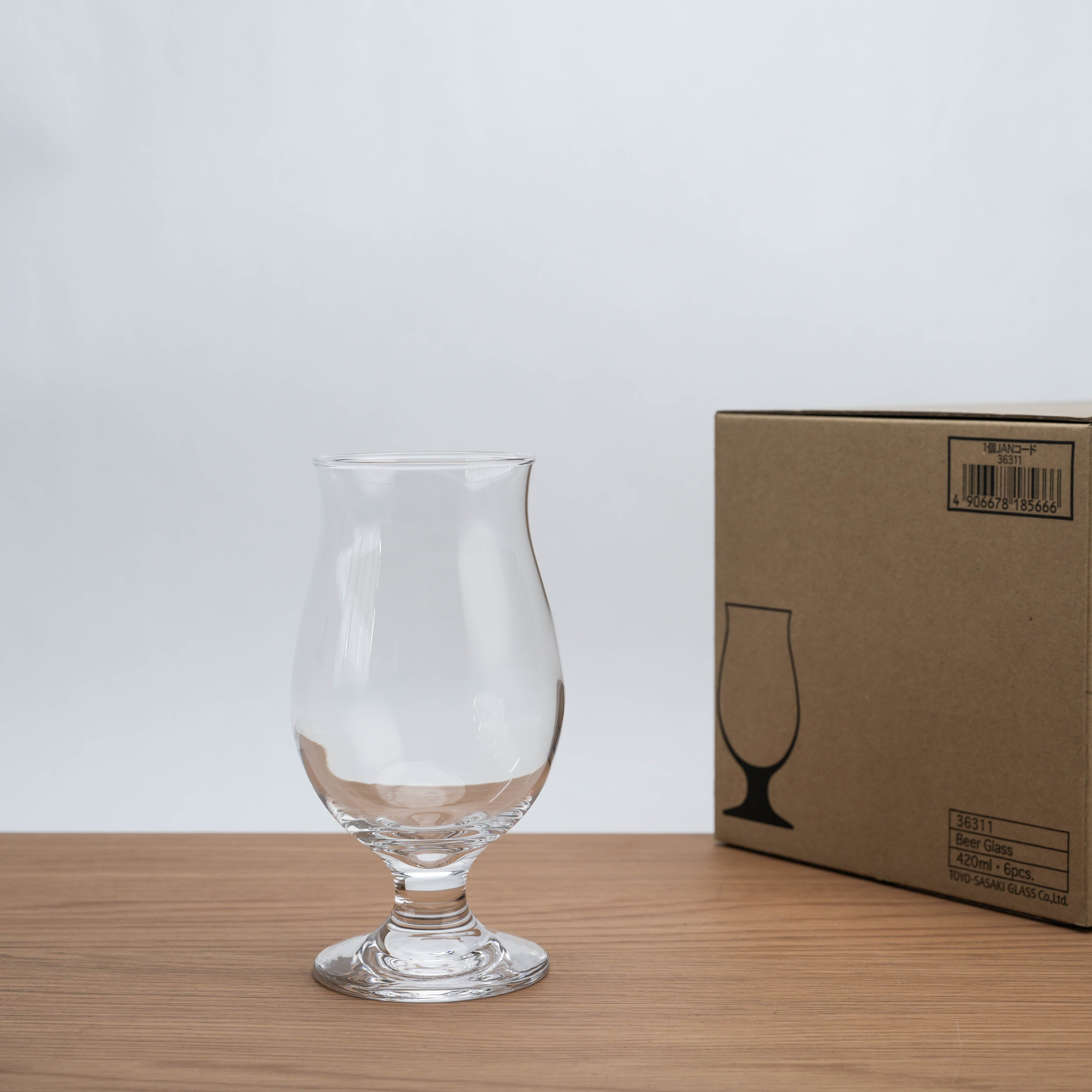 Toyo-Sasaki Tulip Beer Glass next to branded packaging box, perfect for gifting or upgrading home bar drinkware collection.