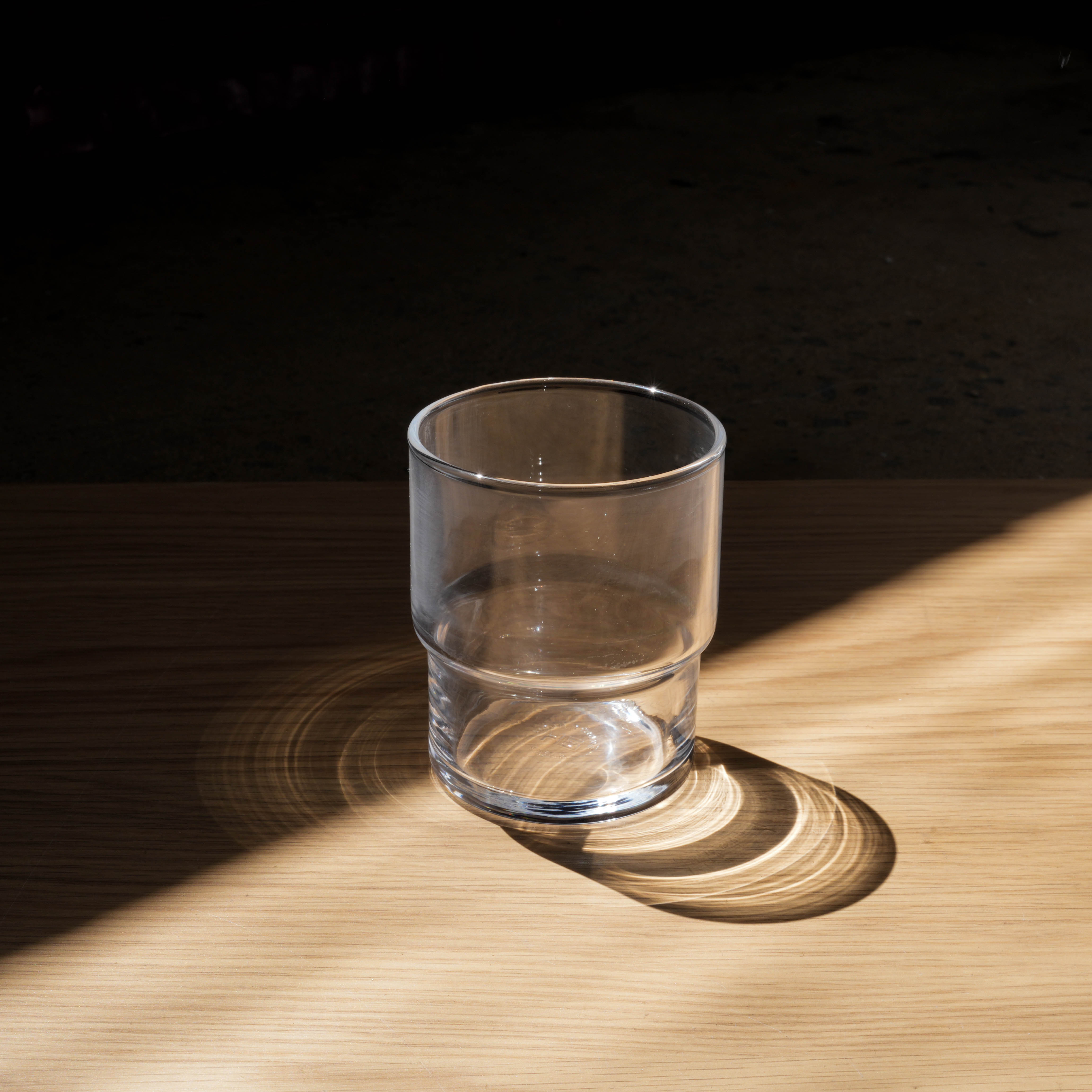 Toyo-Sasaki HS Stackable Tumbler with 200ml capacity shown on wood surface, highlighting its durable, minimalist design for modern drinkware needs.