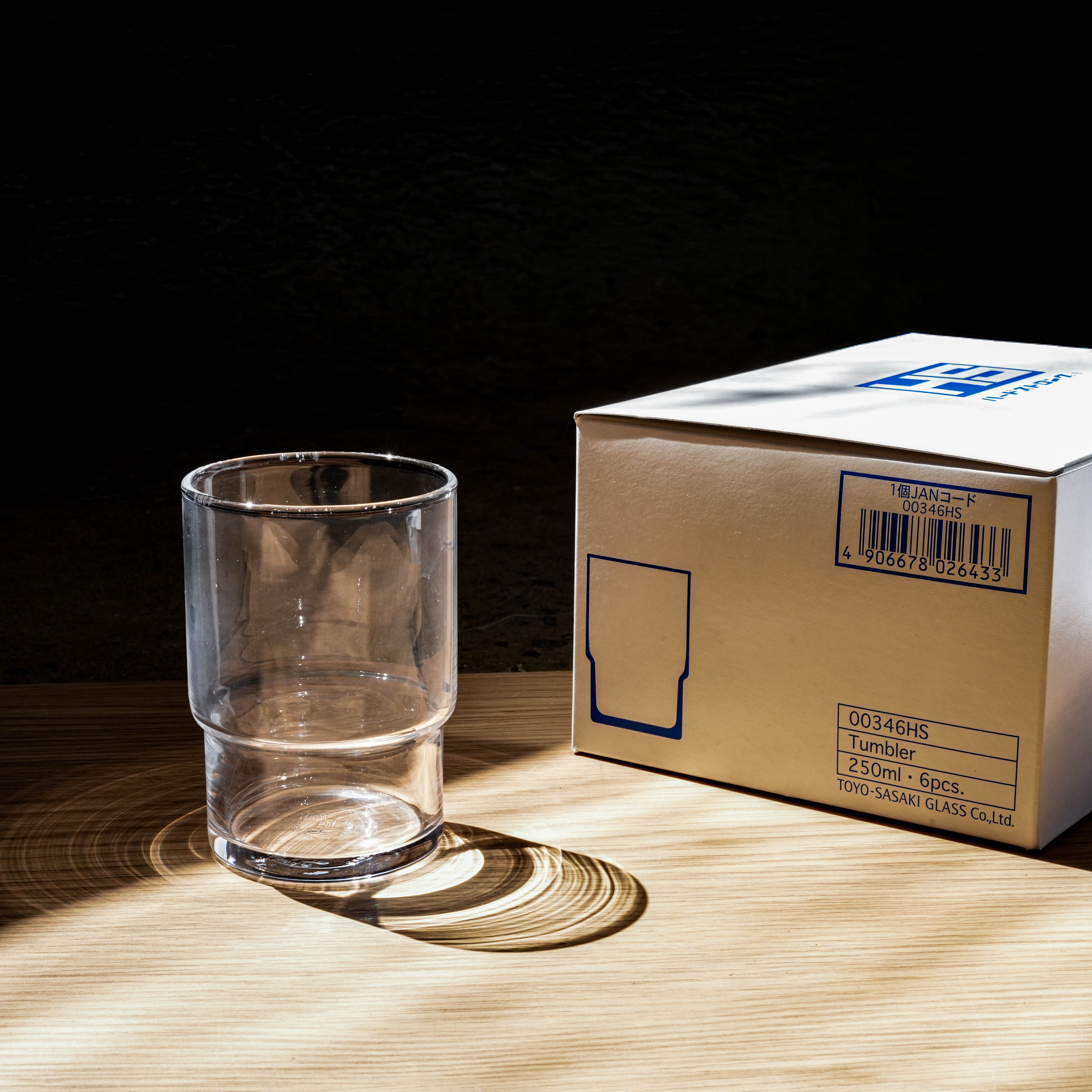 250ml Toyo-Sasaki Stackable Tumbler next to product box, emphasizing the elegant, space-saving design perfect for home and garden drinkware collections.