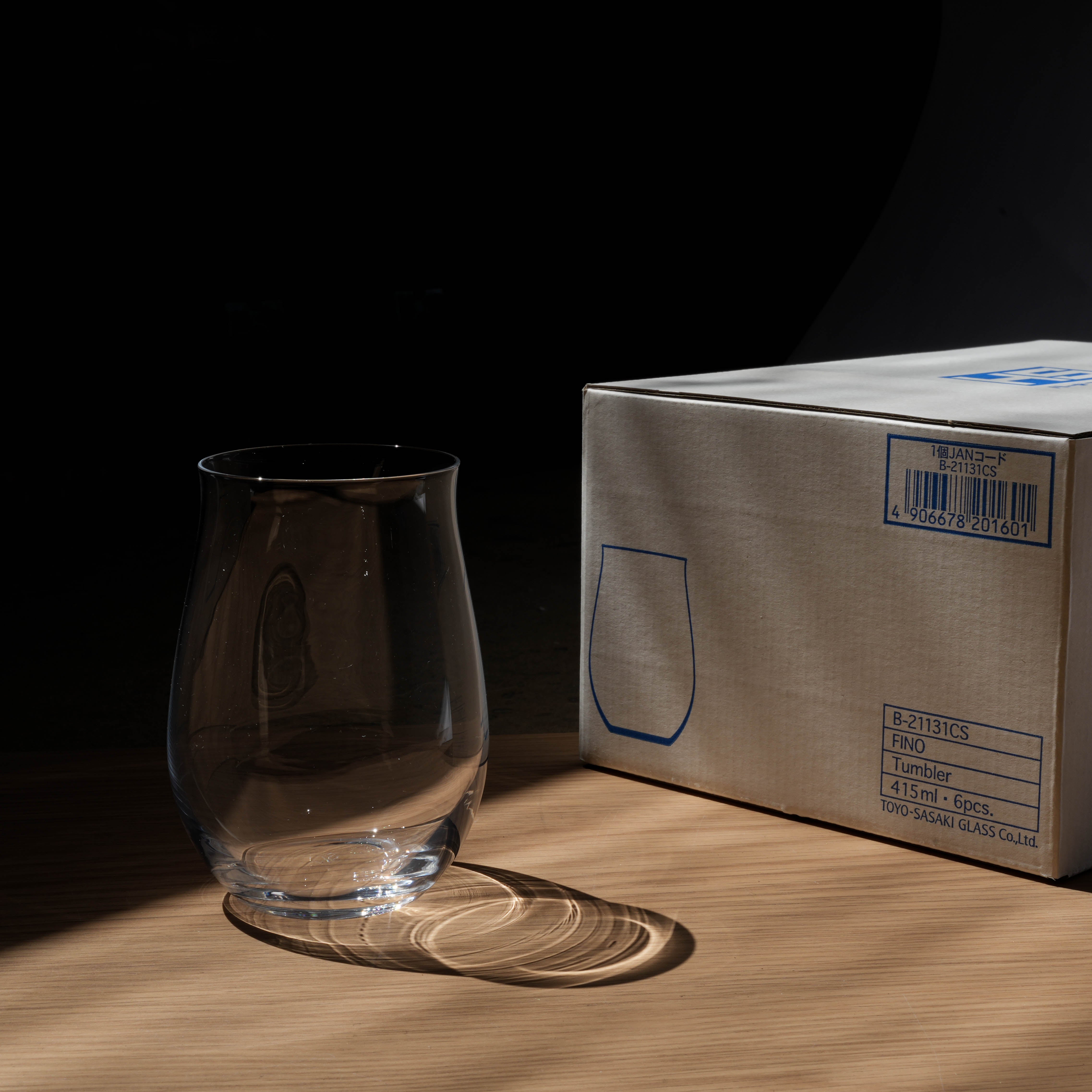 Toyo-Sasaki HS Fino Wine Glass Tumbler beside branded packaging box, 475ml capacity, premium Japanese drinkware for elegant wine serving.