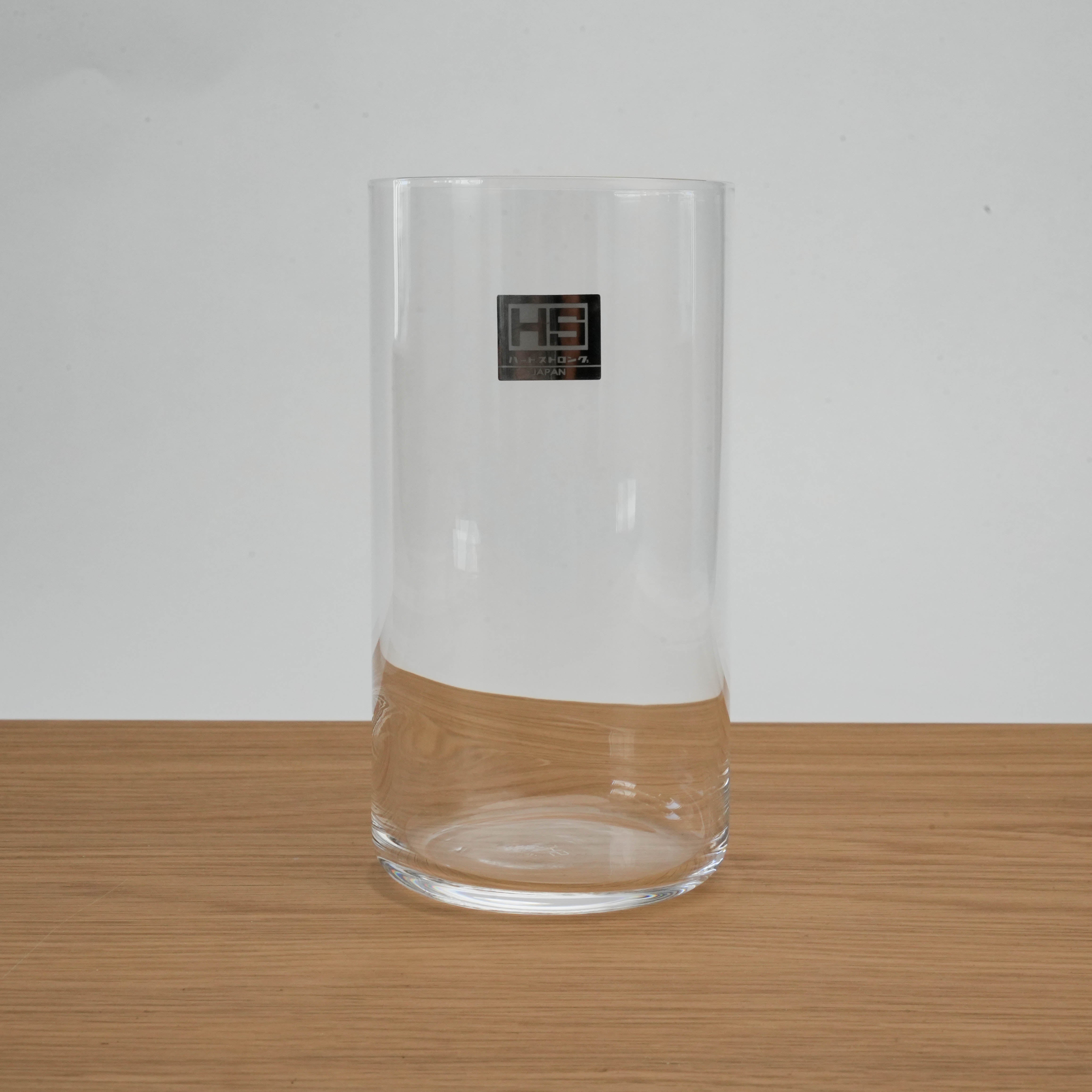 Toyo-Sasaki Tall Tumbler featuring HS scratch-resistant glass, displayed upright with brand label on a wooden tabletop background.