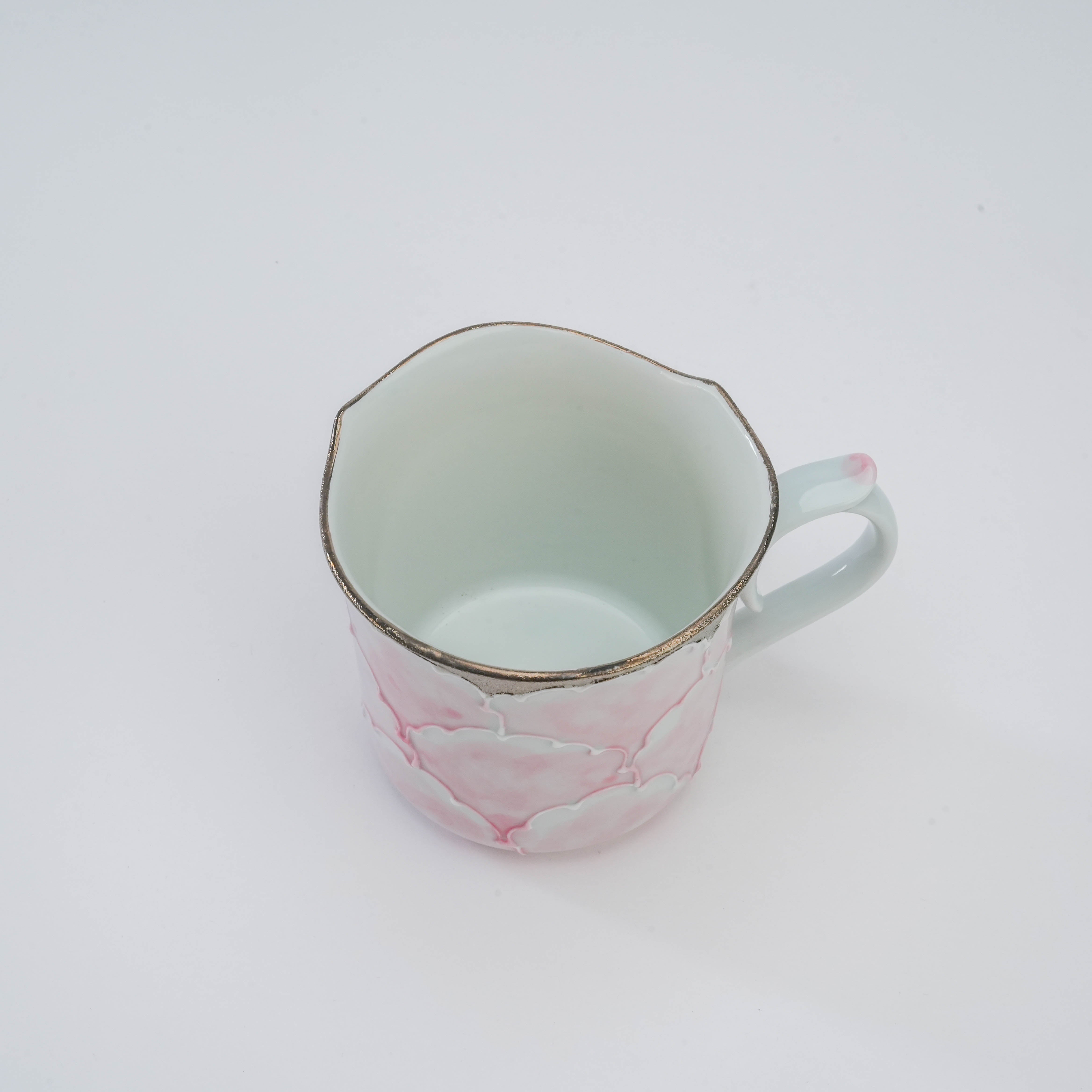 Top view of Arita Peony Mug showing scalloped silver rim and delicate porcelain interior, crafted by Bunzan Kiln for refined drinkware collections.