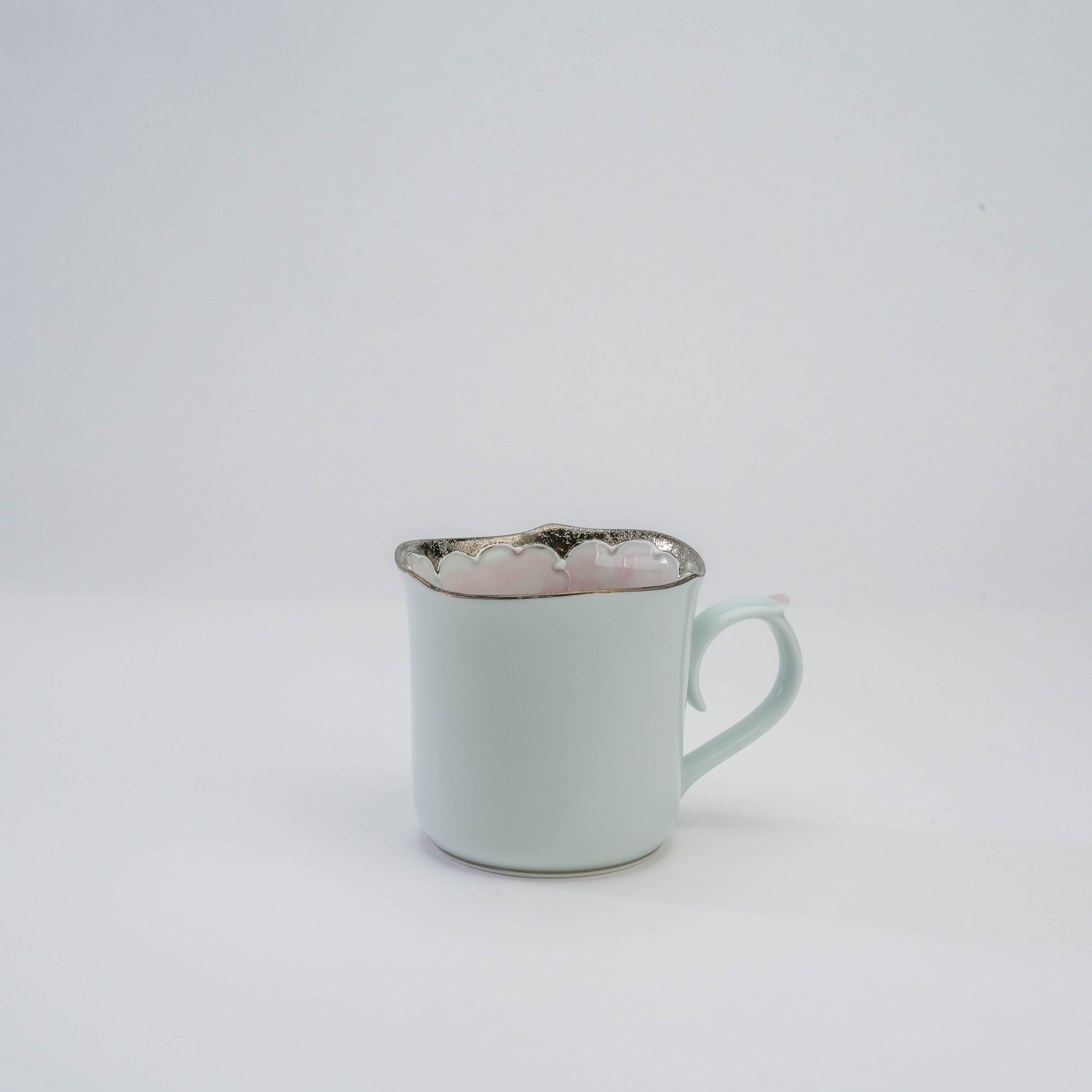 Peony Mug by Bunzan Kiln - Arita Peony Mug in porcelain with soft pink exterior and silver-rimmed floral interior, elegant Japanese craftsmanship.