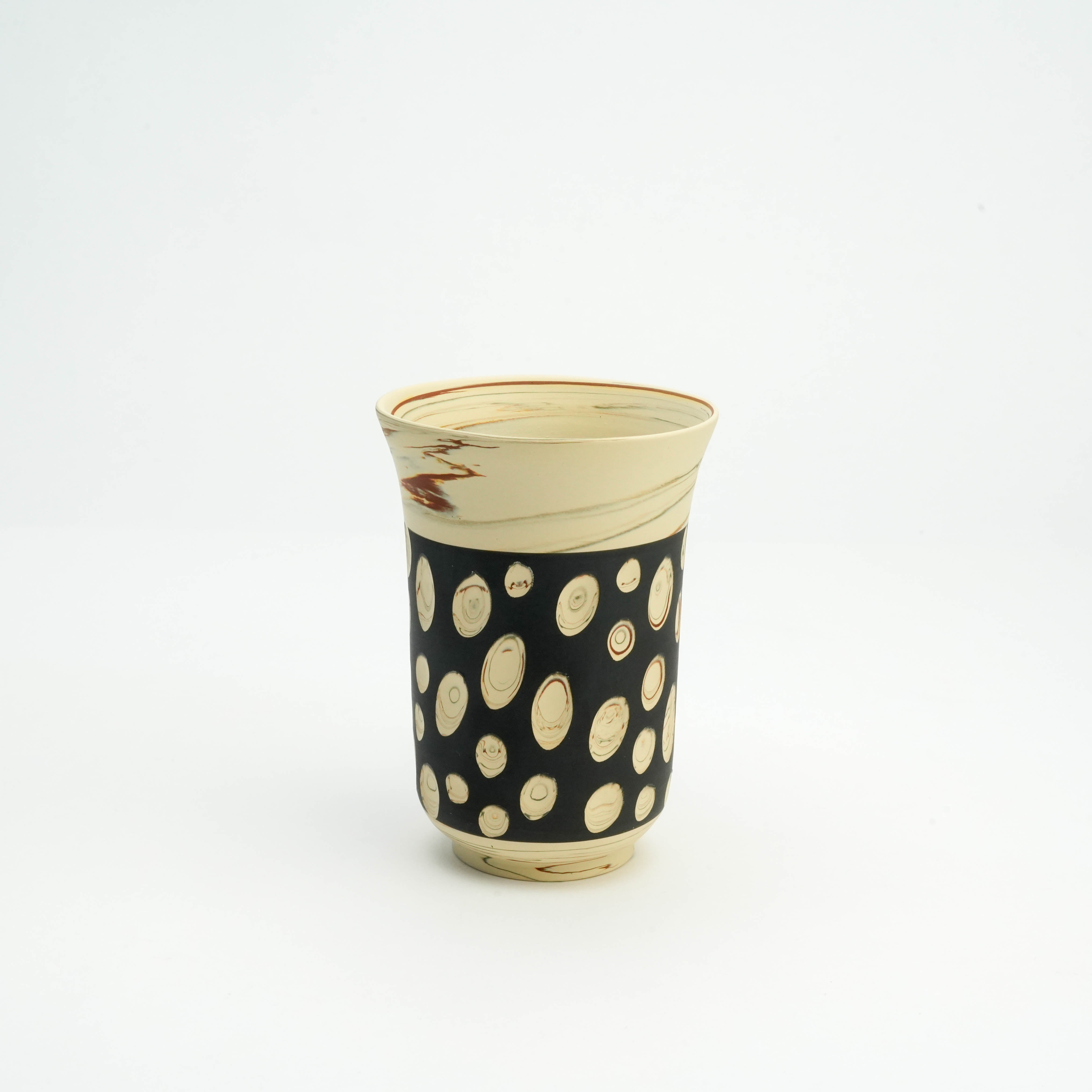 Elegant Tokoname Ware polka dot tumbler in black with swirling nerikomi patterns, perfect for stylish drinkware collections.