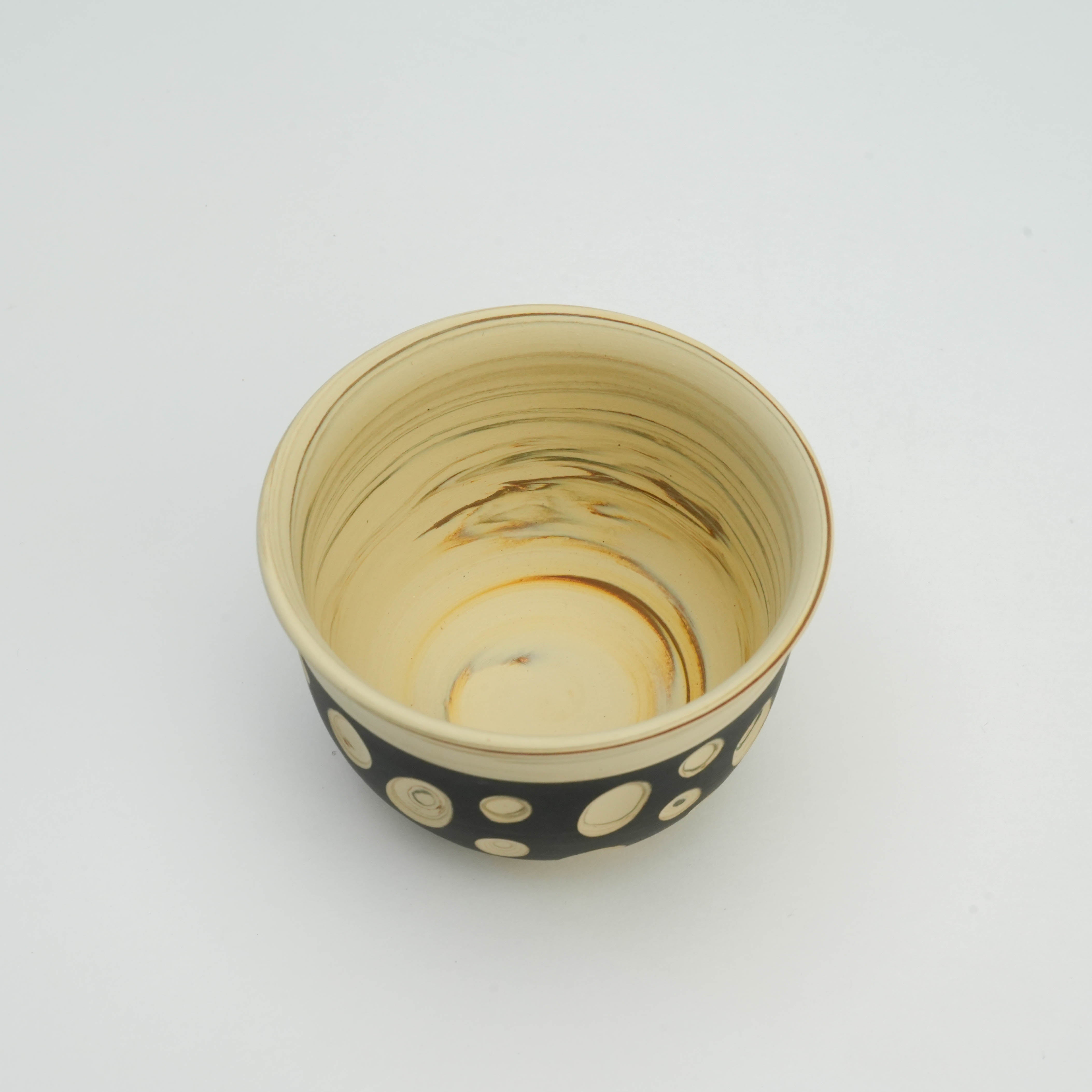 Top view of Tokoname Teacup showing marbled interior and polka dot nerikomi exterior, part of the artisan Japanese tea set.