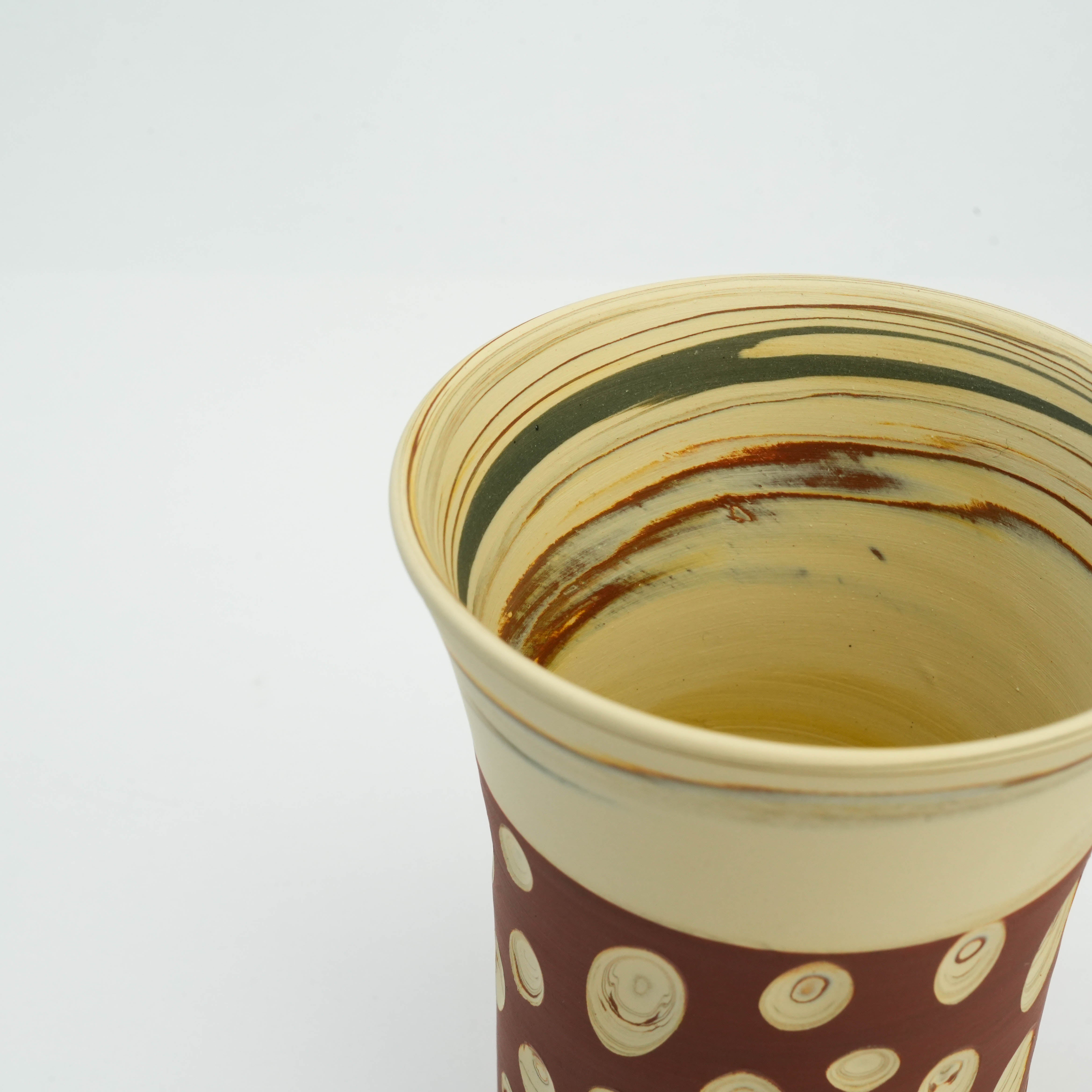 Close-up of Tokoname Ware Red Tumbler interior showing swirling glaze detail, highlighting Japanese craftsmanship in drinkware.