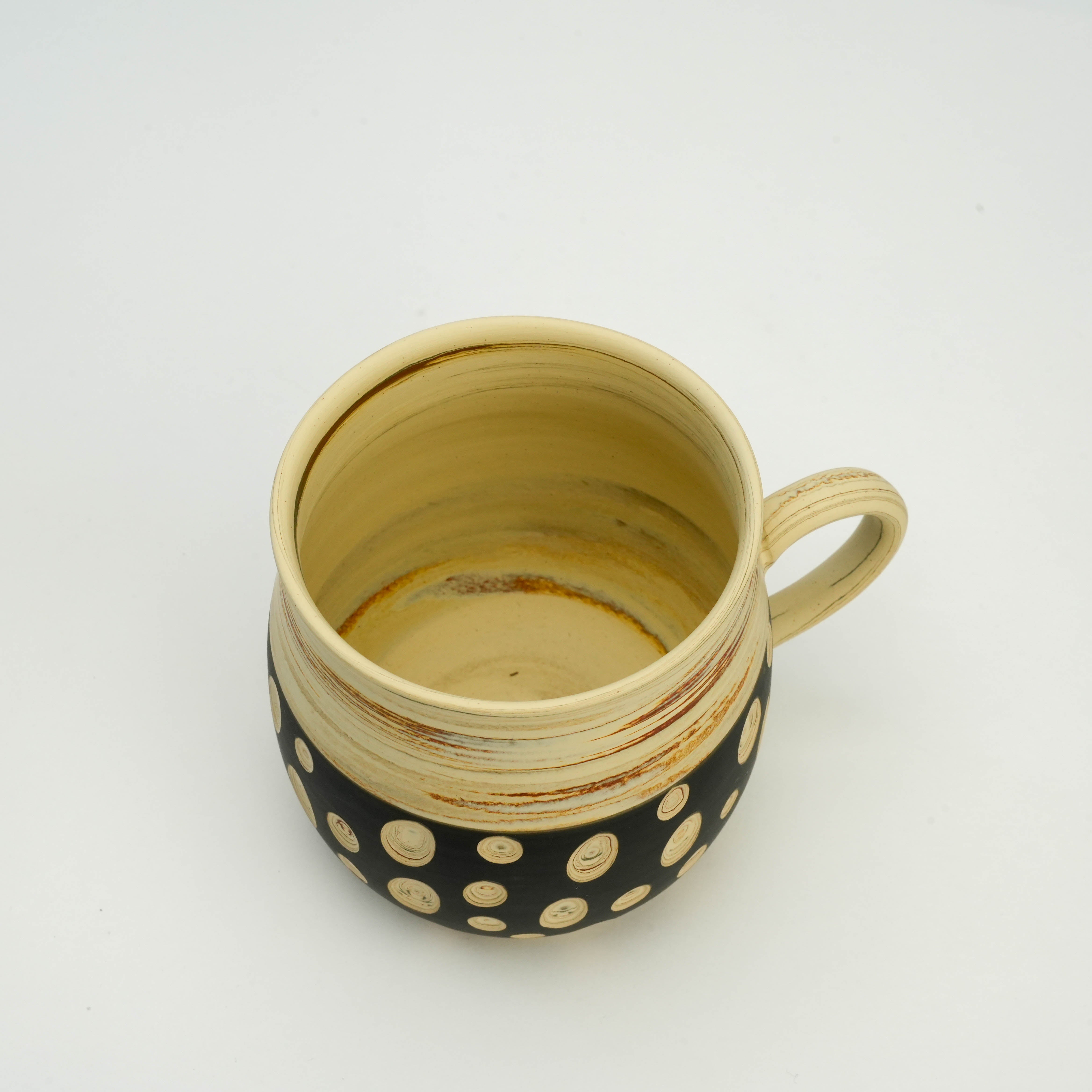 Top view of Tokoname Mug - Handcrafted Ware | Polka Dots, Kenji Touen showing spacious cream interior and ergonomic handle for daily use.