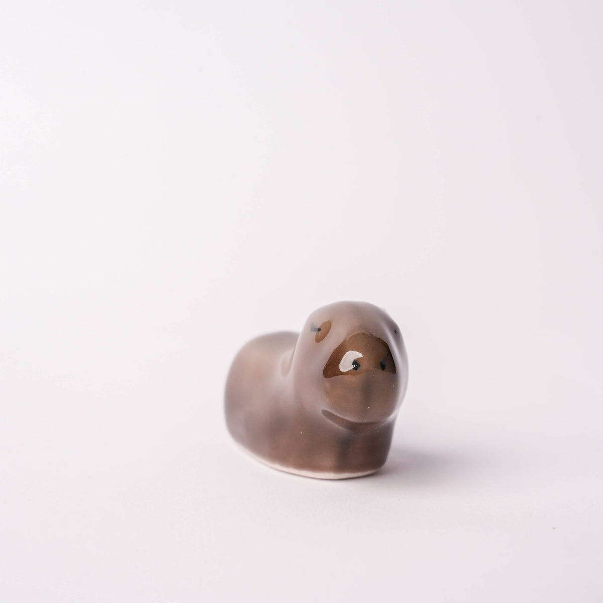 White ceramic capybara figurine, small decorative animal, used as a chopstick rest, handcrafted Japanese pottery, SKU: 12345