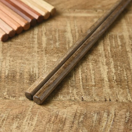 Close-up of Kawai Tetoca Persimmon Wood Chopsticks showing square tips and octagonal grip for secure handling and precise control.