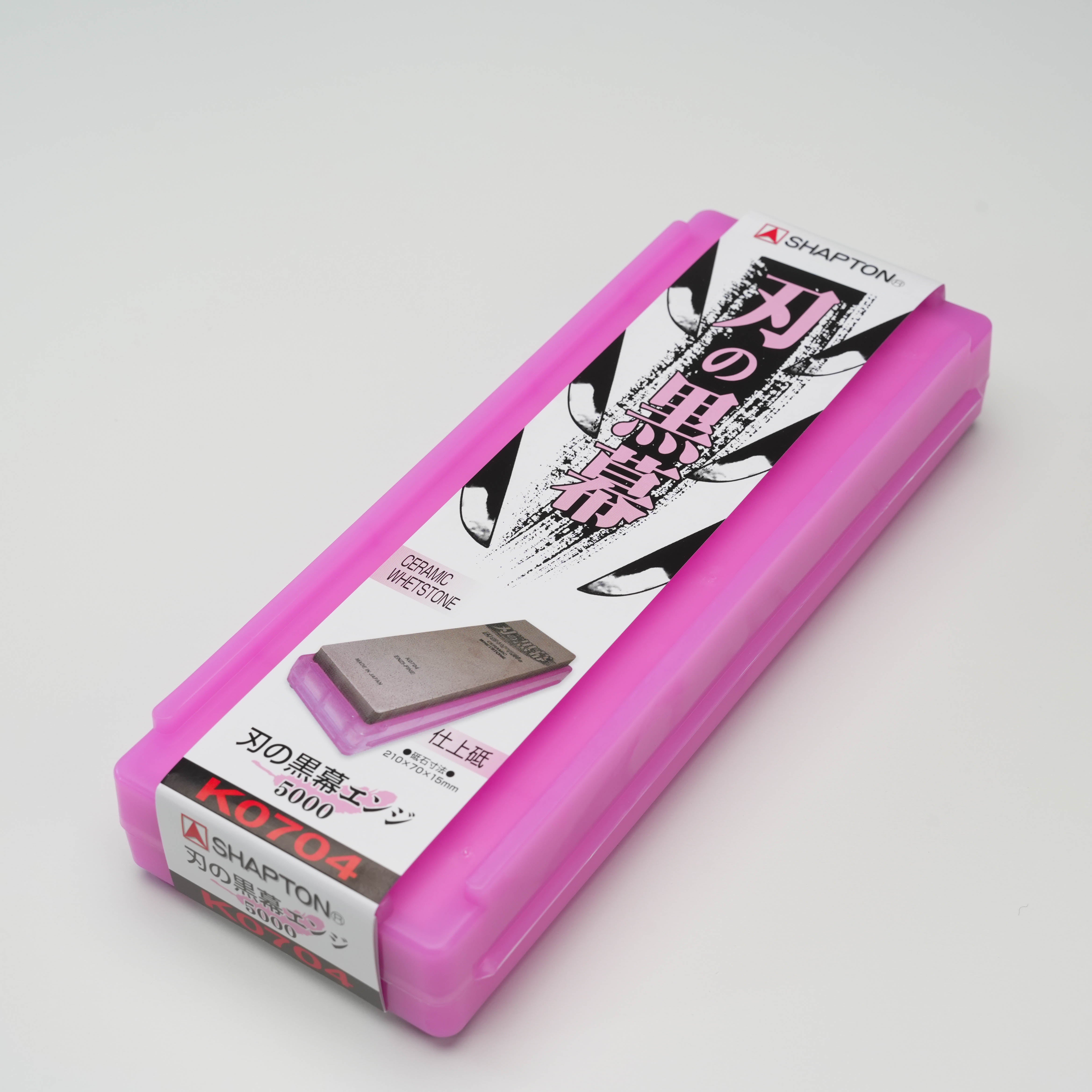 Shapton Kuromaku-5000 Grit Sharpening Stone in pink storage case for precise knife care. Ideal for home chefs seeking professional sharpening results.