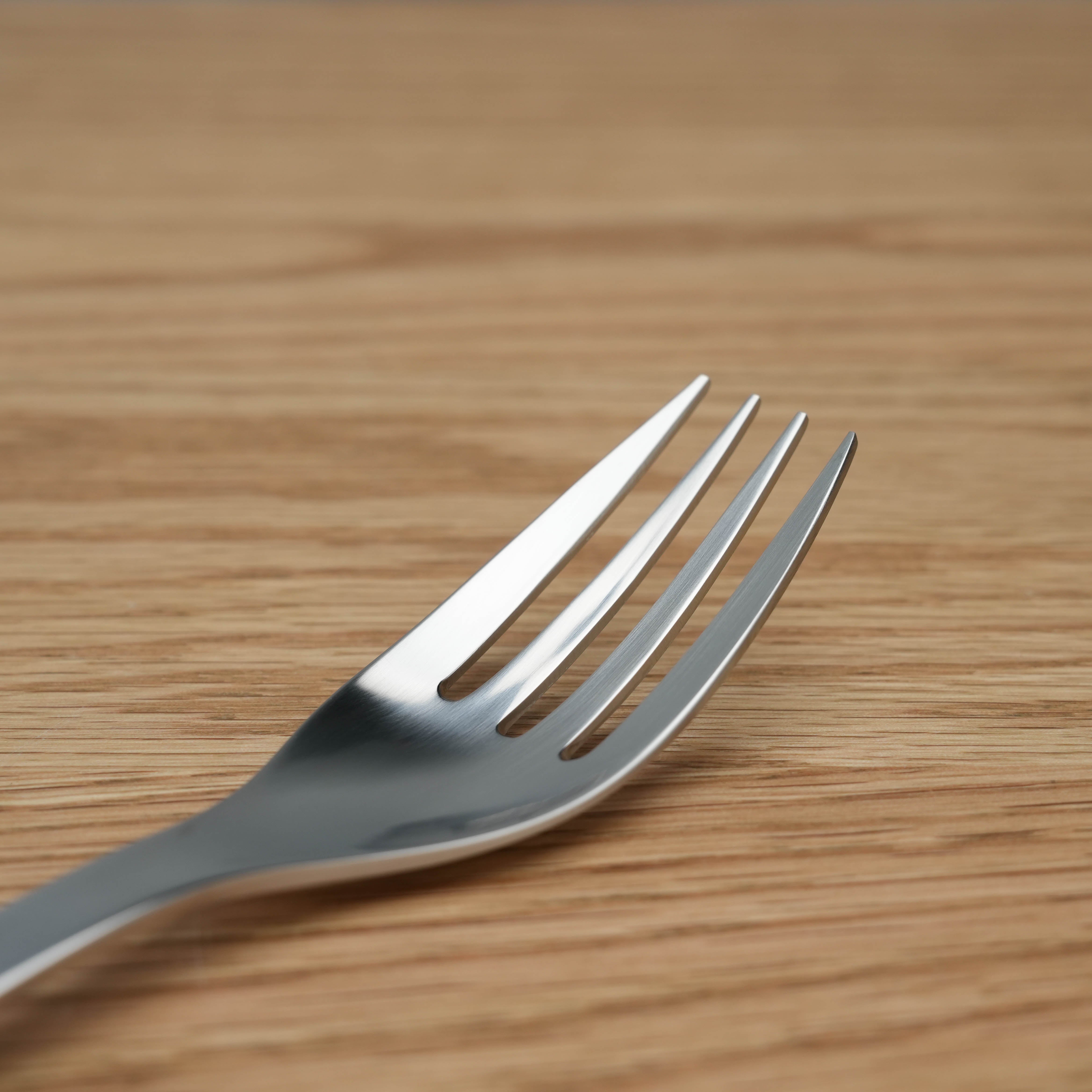Close-up of Sori Yanagi Stainless Steel Pasta Fork showing precision-crafted prongs. Japanese design perfect for stylish kitchen use.