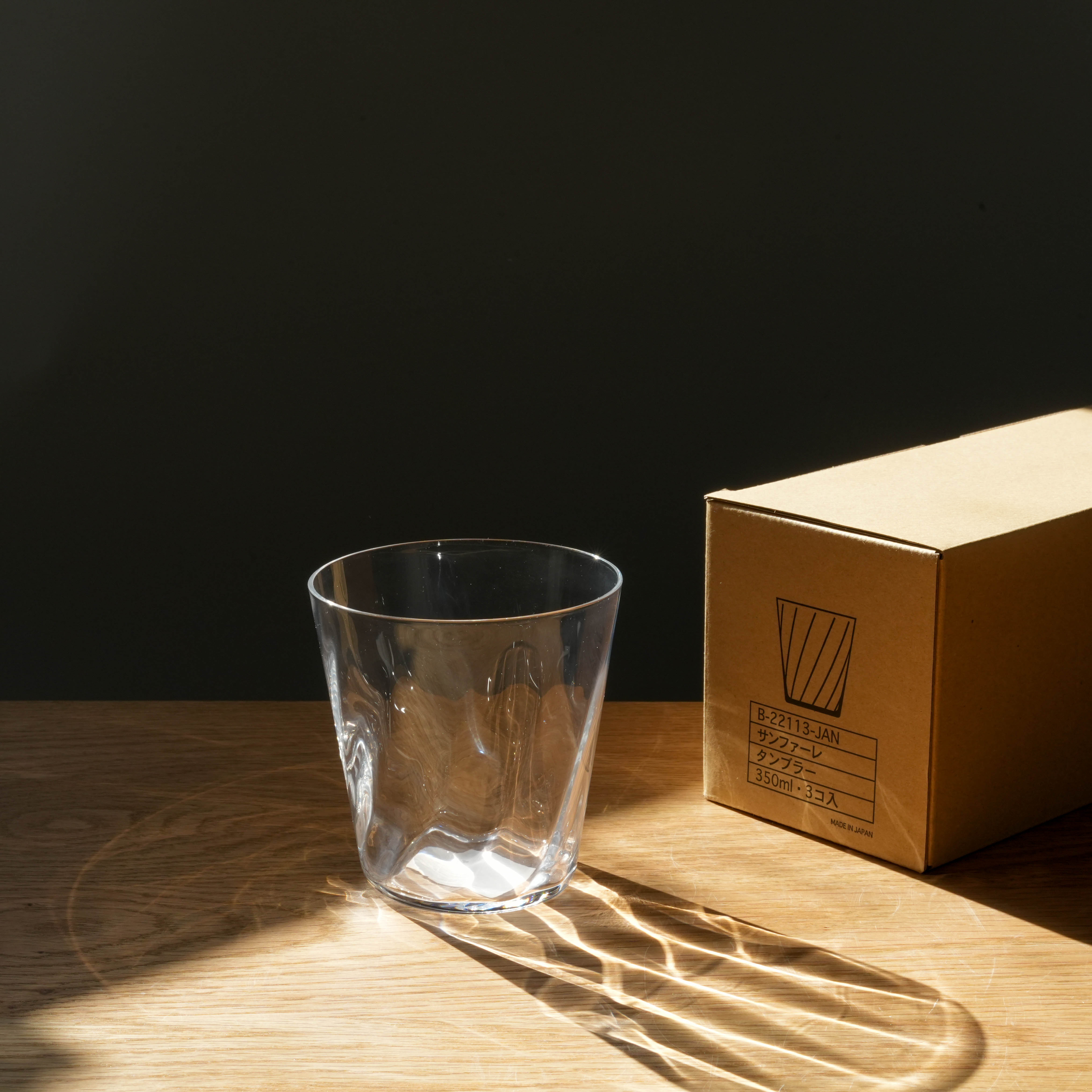 Toyo-Sasaki Sunfare Tumbler Set - Fine Clear Glass tumbler beside branded box, showcasing durable, elegant design for premium kitchen and dining use.