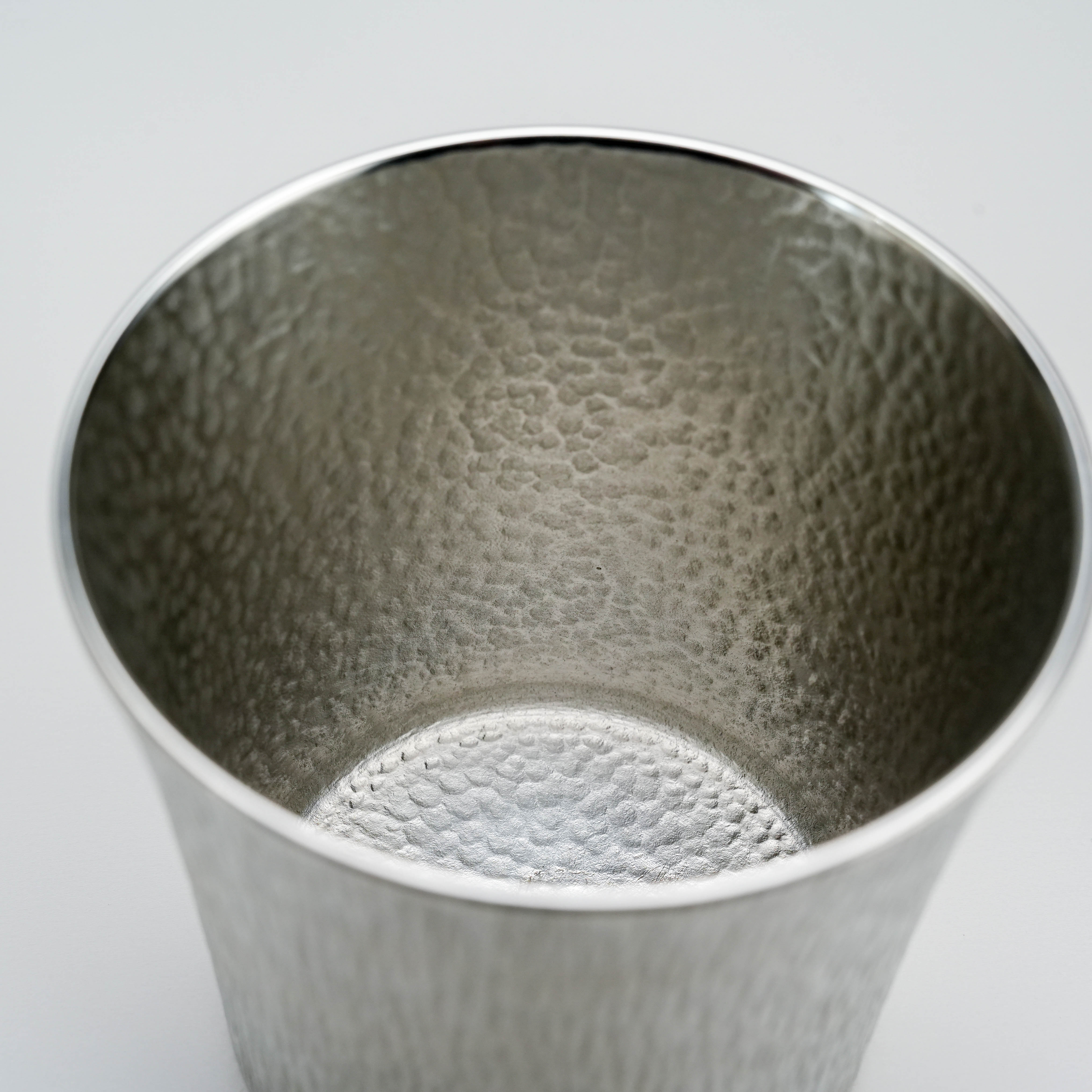 Interior view of the Suzuki Tinware Funnel Tumbler revealing its hammered tin texture, perfect for refined kitchen and dining use.