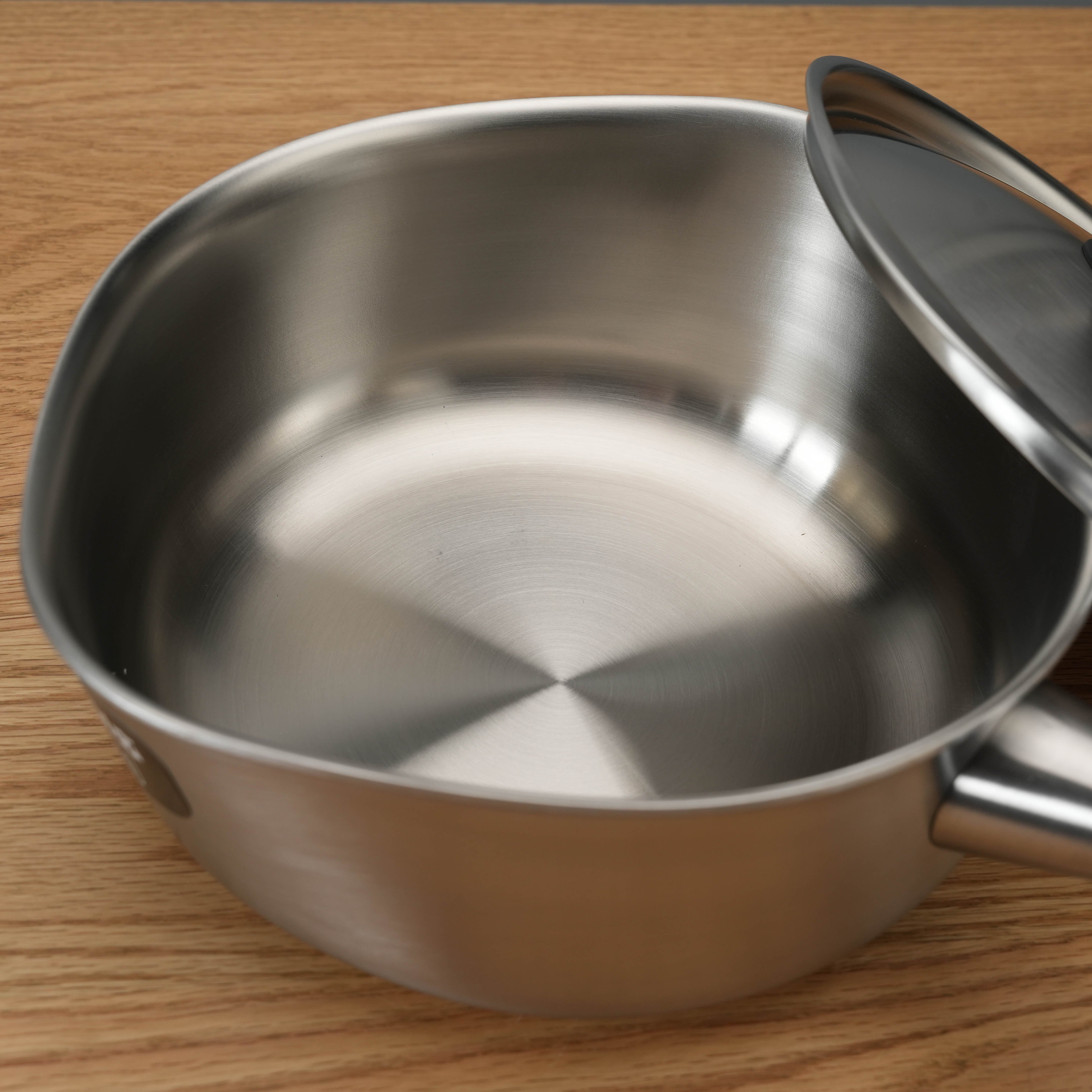 Interior view of Sori Yanagi 3-Ply Stainless Steel Induction Saucepan showing seamless brushed steel finish for even heat distribution.
