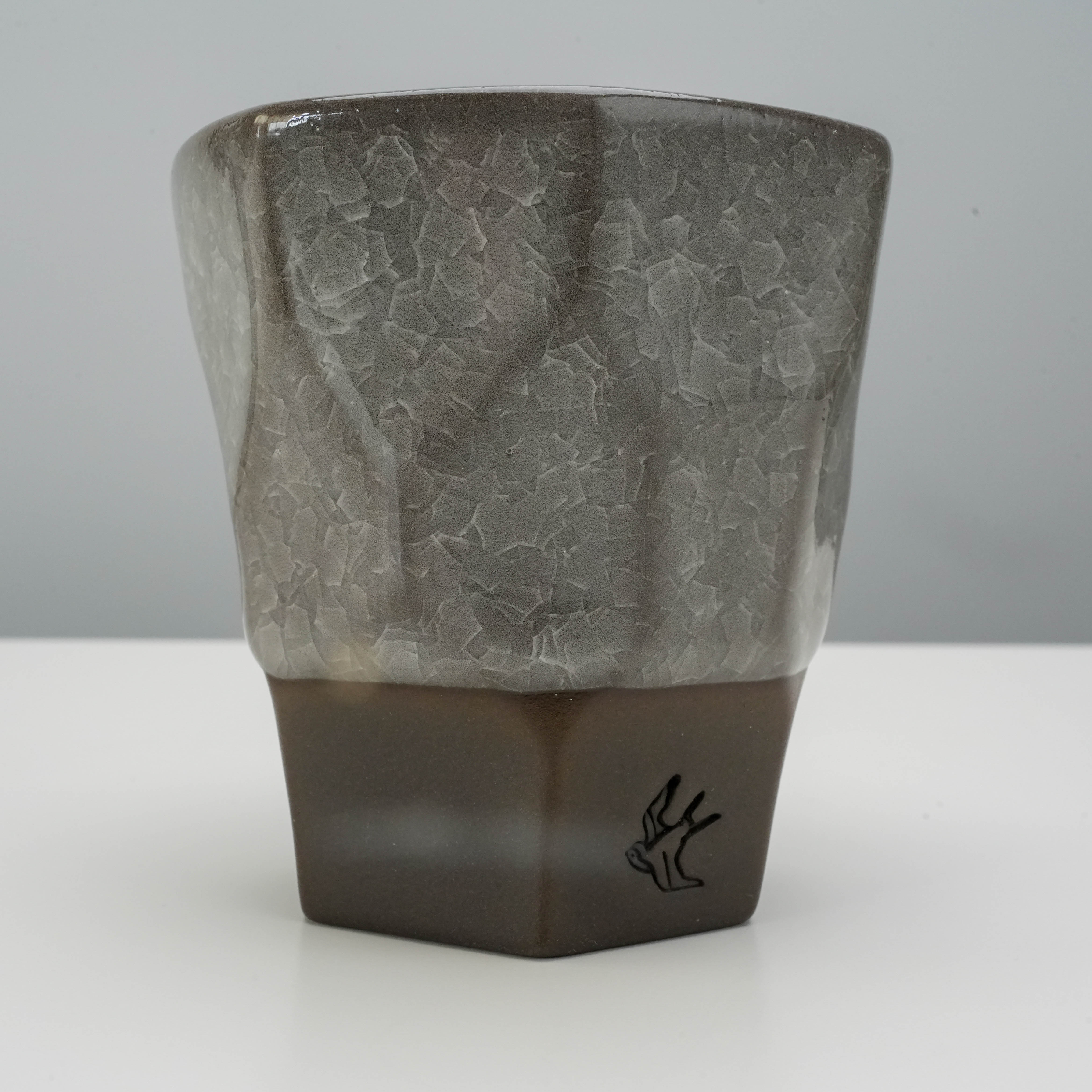 Side view of Tsubame Kobo Free Cup - Clay Craft Ice Crack with detailed ice crack glaze and matte black clay lower half.