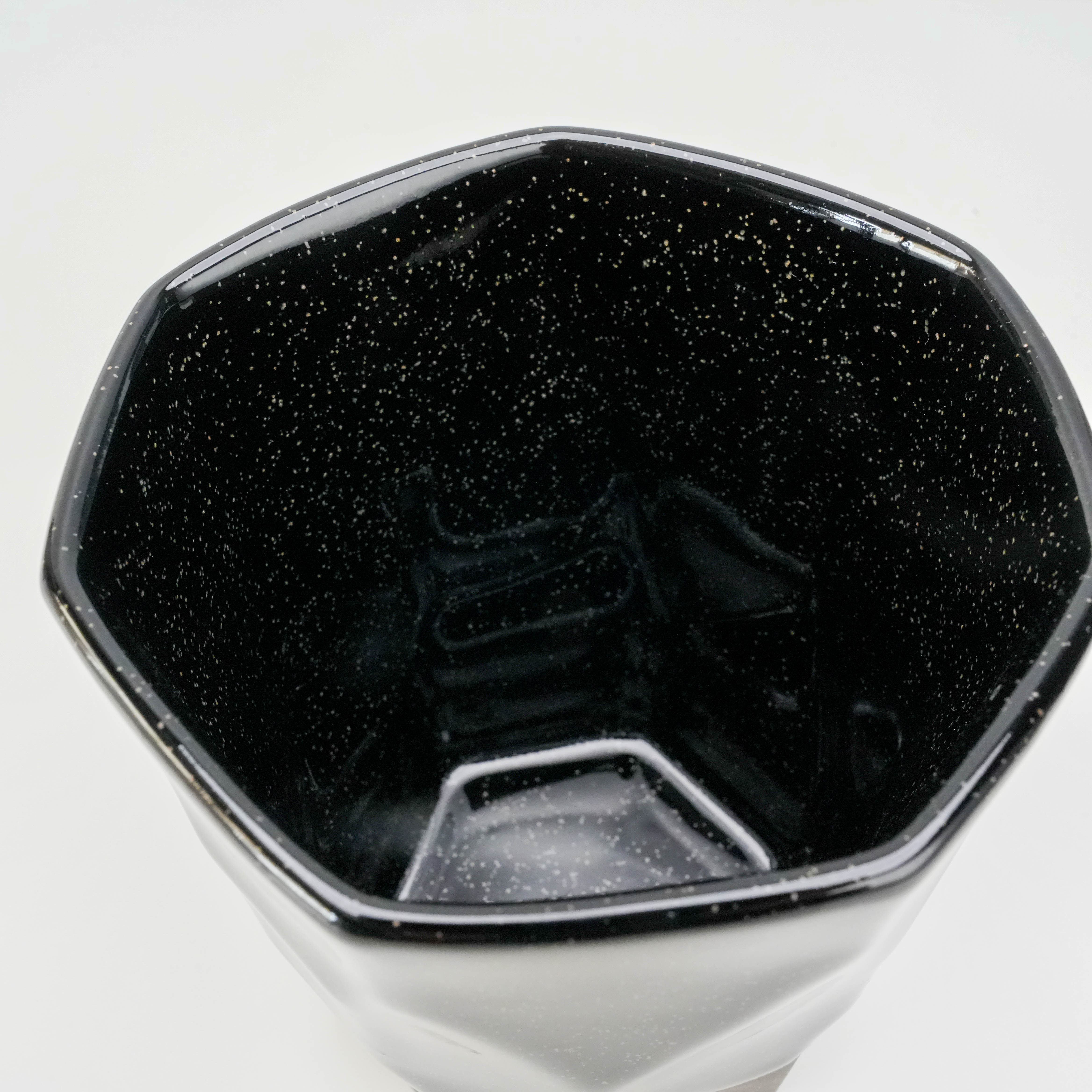 Interior view of Tsubame Kobo Free Cup showing glossy black glaze with starry speckled finish, crafted from black clay.