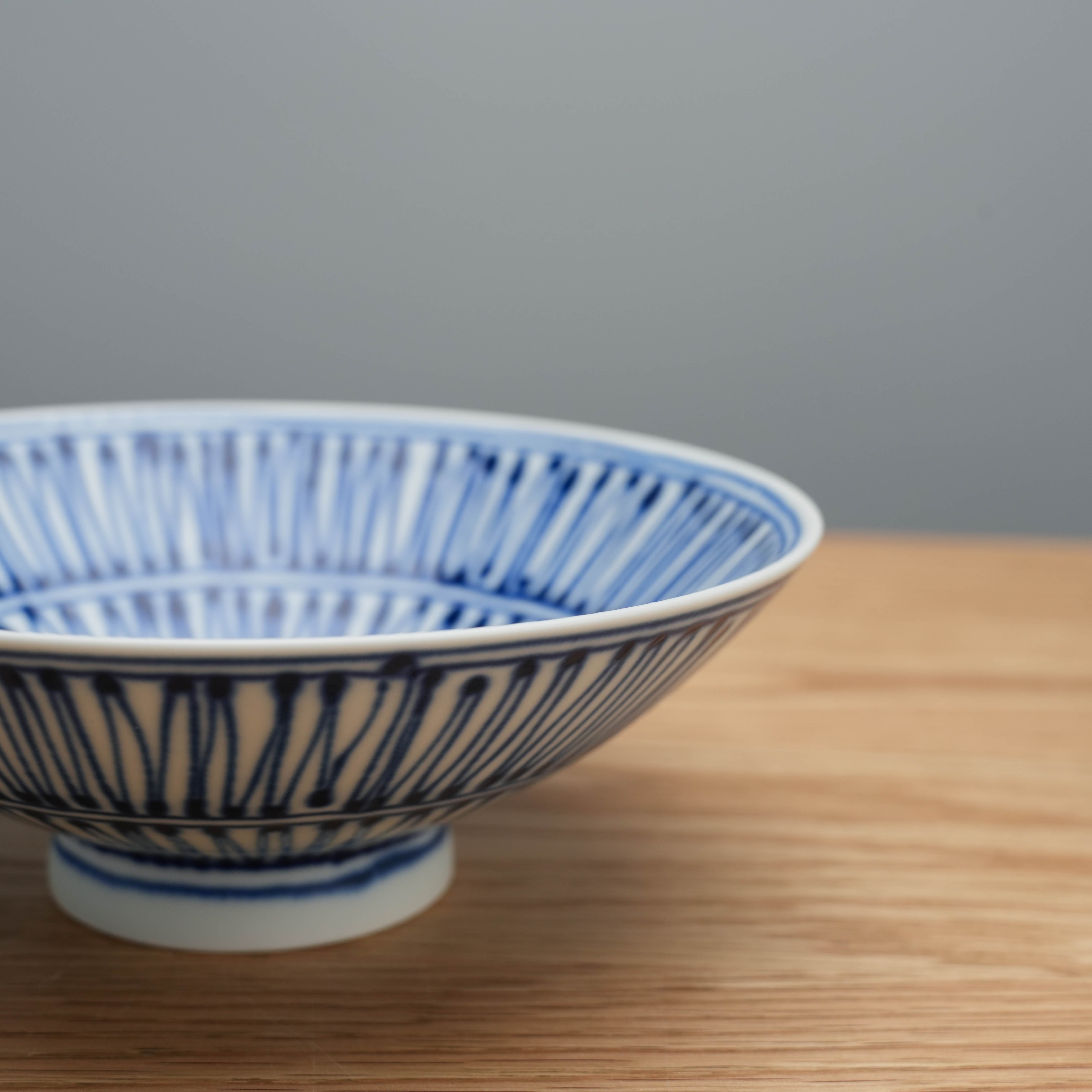 Angled view of Hasami Ware Hakusan Flat Bowl highlighting its award-winning design and craftsmanship, ideal for kitchen and dining decor.