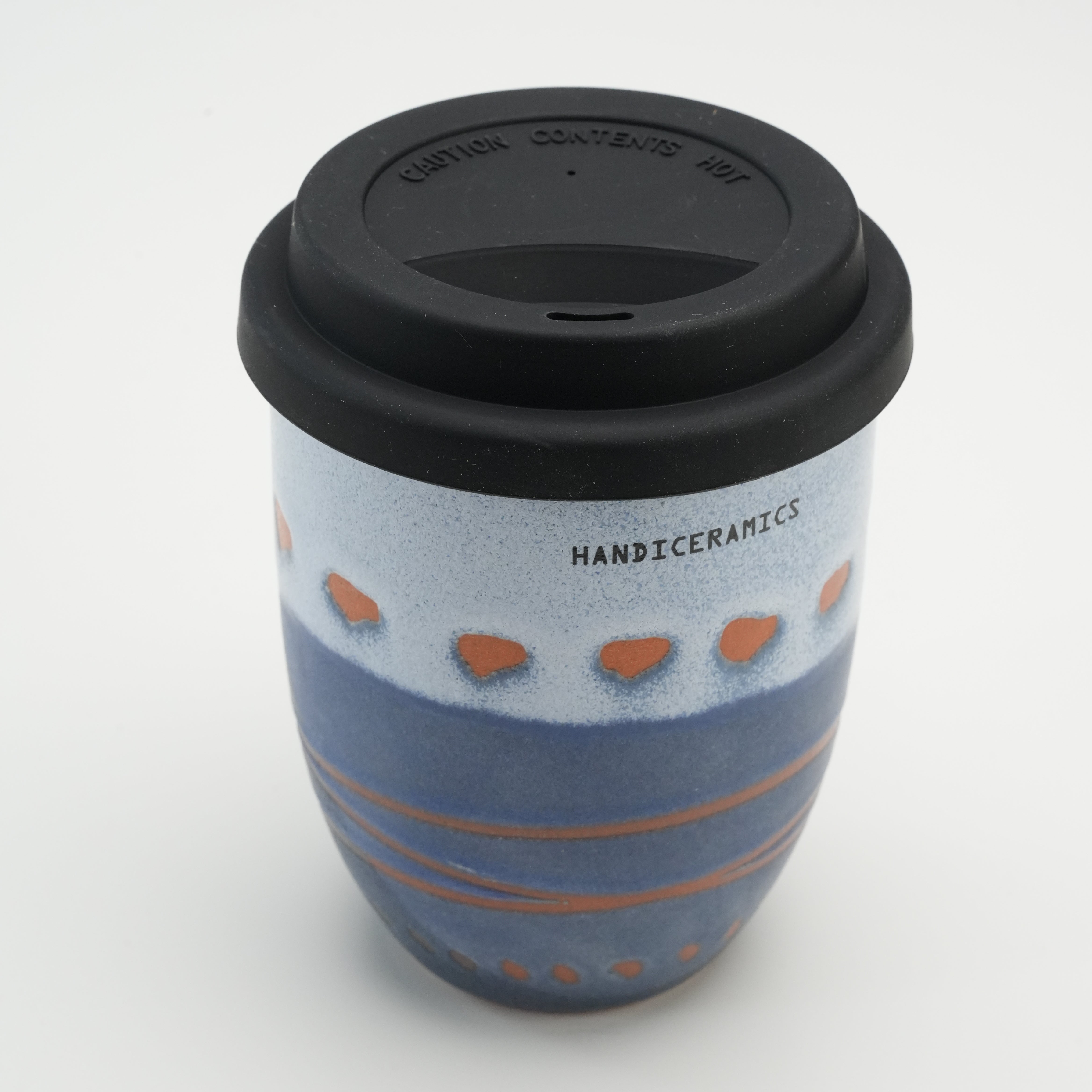 Top view of Handiceramics Ceramic Coffee Cup with Lid in Marine, highlighting the secure black silicone lid and handcrafted ceramic body.