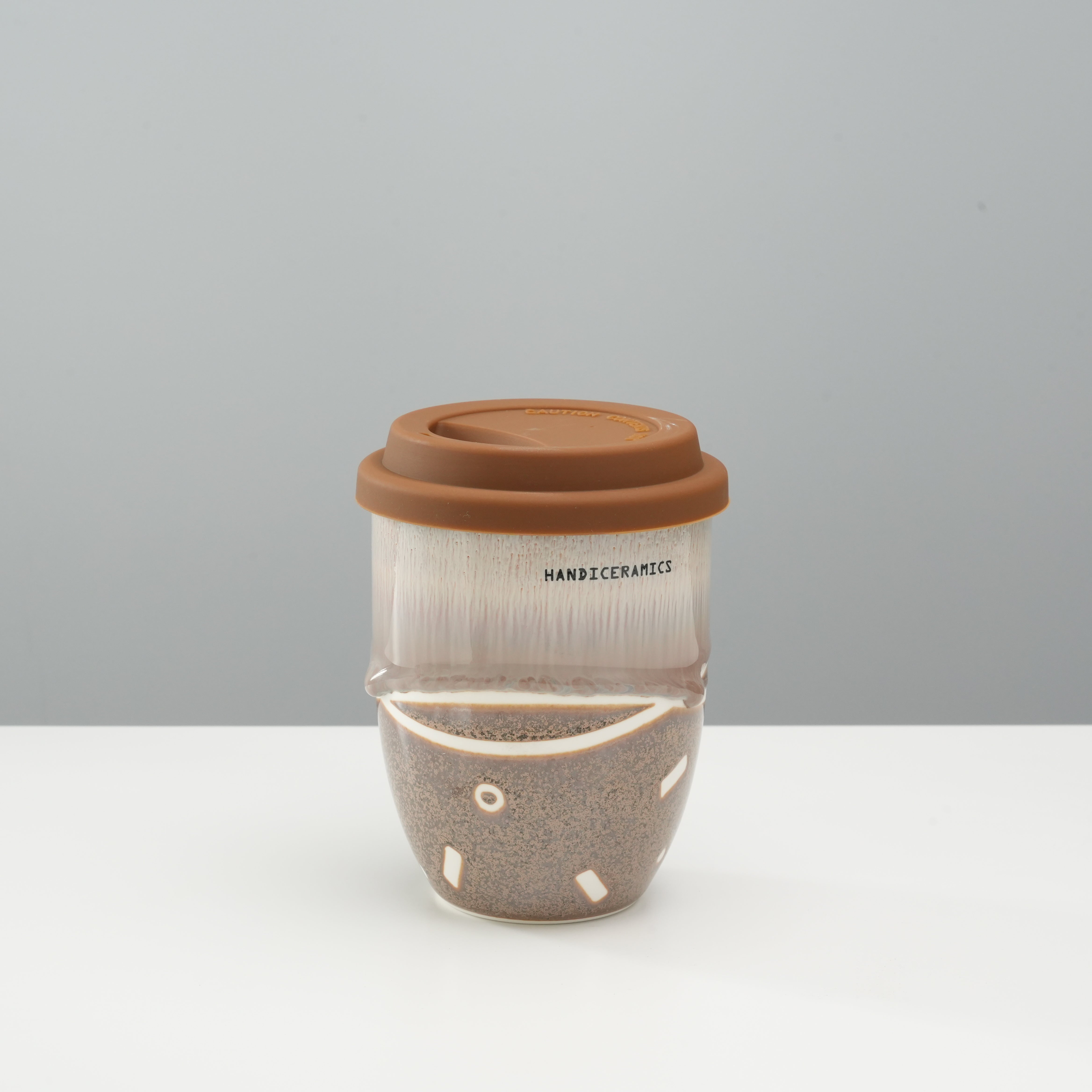 Tall version of Handiceramics Travel Cup - Ceramic Coffee Cup with Lid in Brown Sugar, handmade with bubble tea-inspired design.