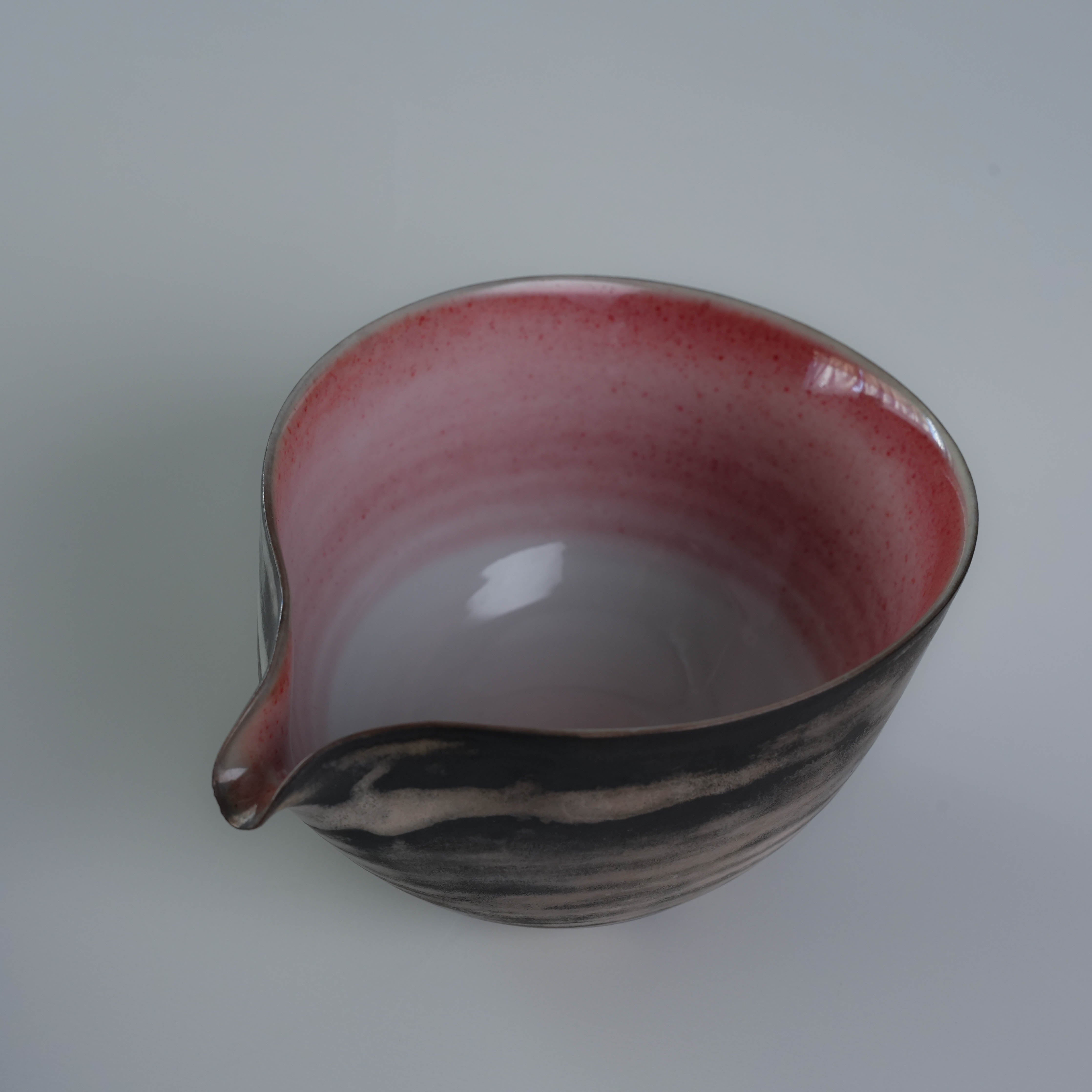 Interior view of Lonesome Studio Qushui tea pitcher, featuring a gradient red glaze and smooth spout, part of silver glaze Gongfu Cha set.